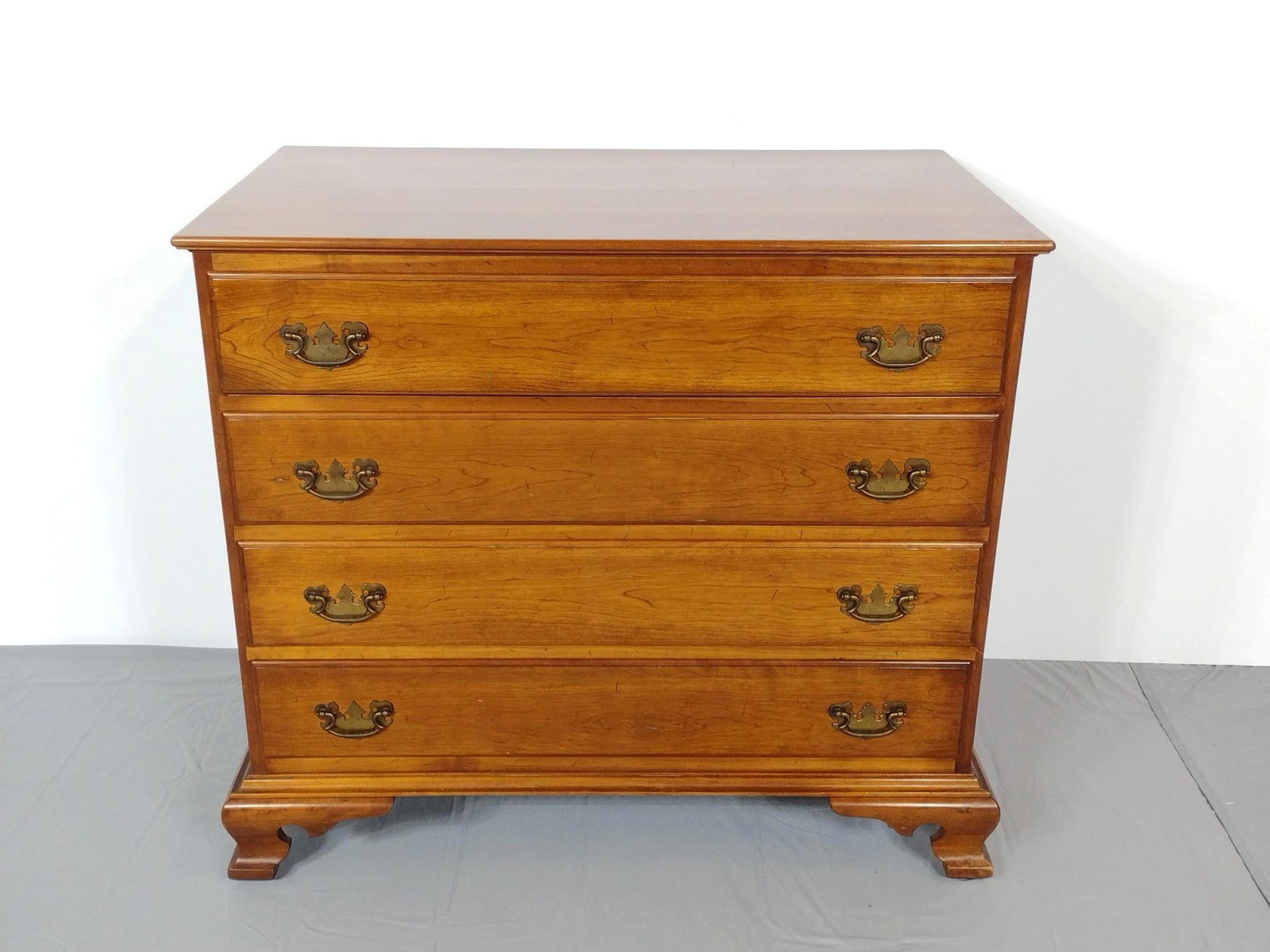Stickley / Leader's Four Drawer Chest: NOT ELIGIBLE FOR IN-HOUSE SHIPPING. Leader's plaque on top left drawer side. Stickley label glued to back left corner of top drawer. 38" wide X 22" deep X 33" high. Left side starting to split. MG.