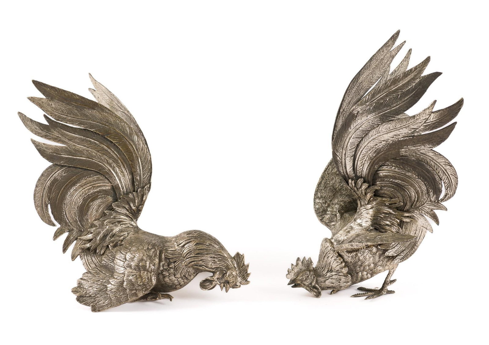 Pair of Cast Metal Roosters: 7" to 7-1/2" wide x 7-3/4" to 10-1/4" high. One missing foot. Minor oxidation.