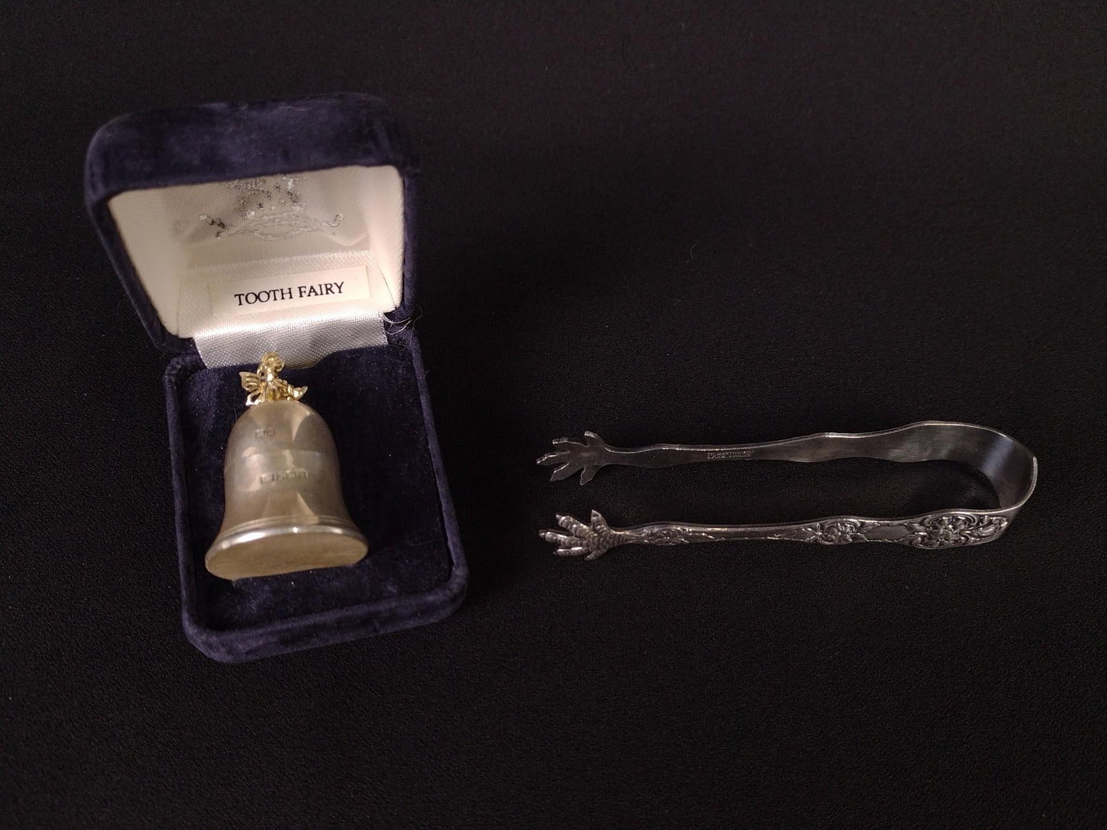 Silver Plate Tongs & Sterling Tooth Holder: Tooth fairy tooth holder sterling with plastic lining and gold colored fairy finial. Tongs 3-1/2" long. Tooth Holder 1-1/2" high. MG.