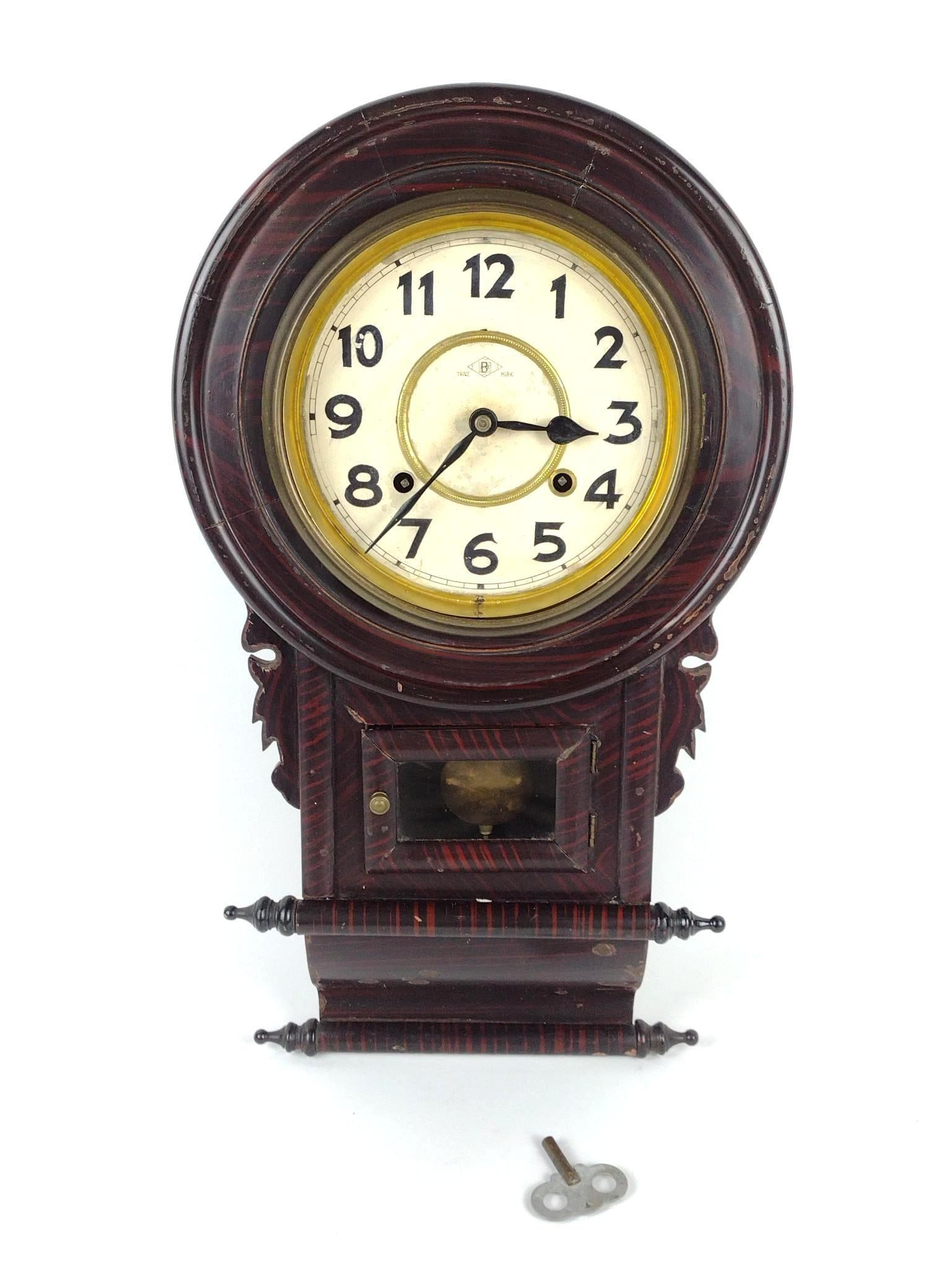 Regulator Wall Clock: 10-3/4" wide X 4" deep X 22" high. Has some scratches and finish loss. Missing front glass. Working. MG.