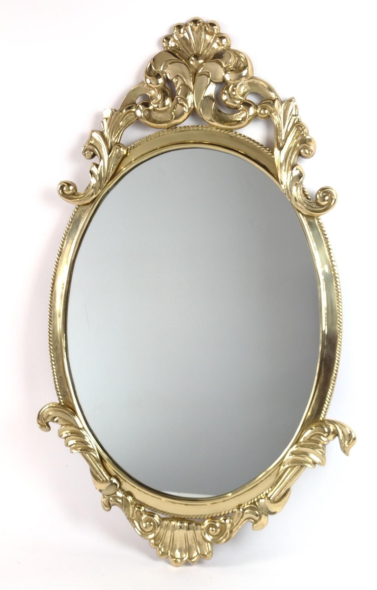 Brass Wall Mirror: NOT ELIGIBLE FOR IN-HOUSE SHIPPING. Overall with frame 35" high x 22" wide. MG.