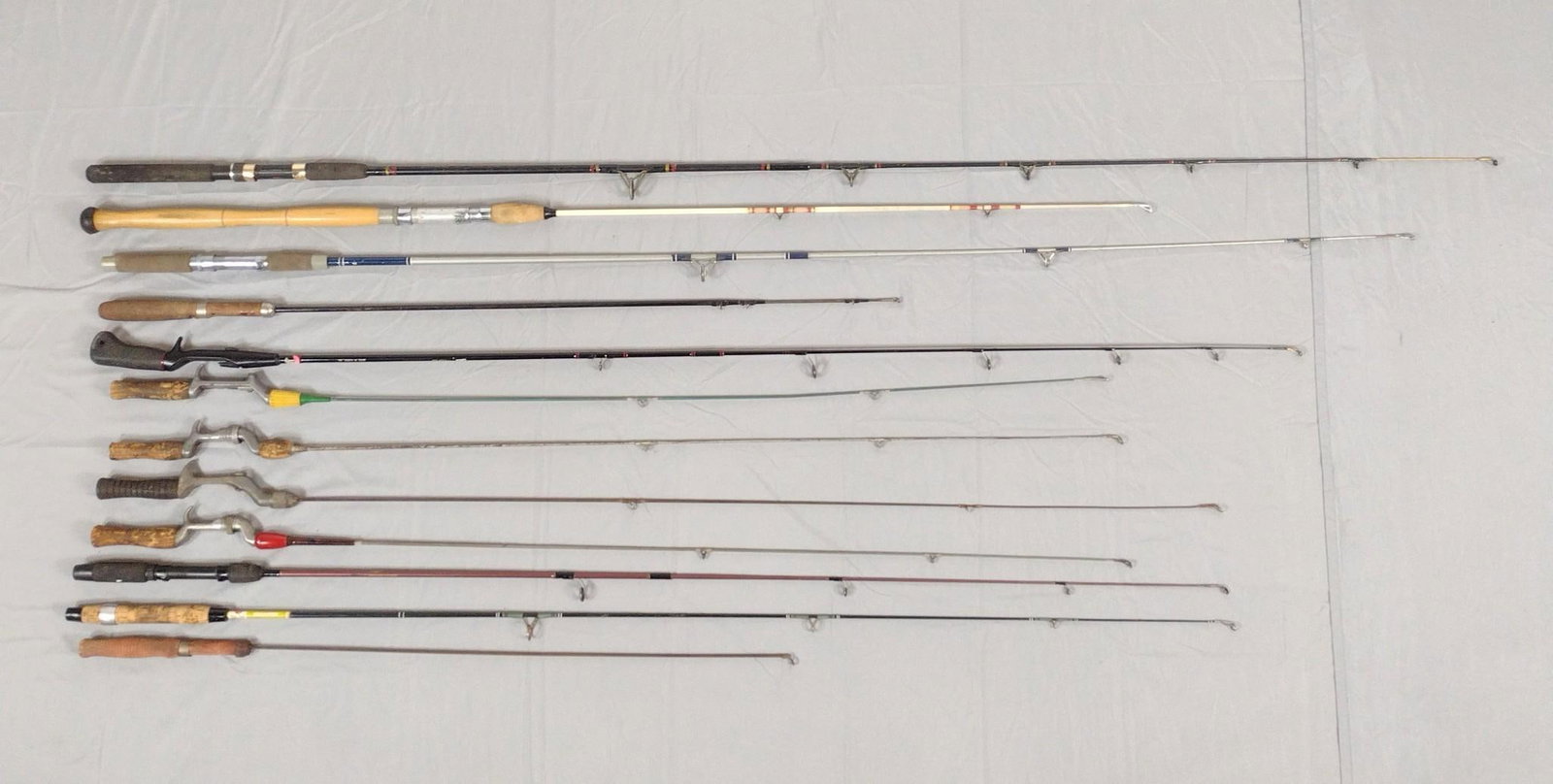 12 Fishing Rods Incl Bristol: NOT ELIGIBLE FOR IN-HOUSE SHIPPING. Also includes Sportsman, South Bend, Abu Garcia and More. Rods 37" to 76" long. MG.