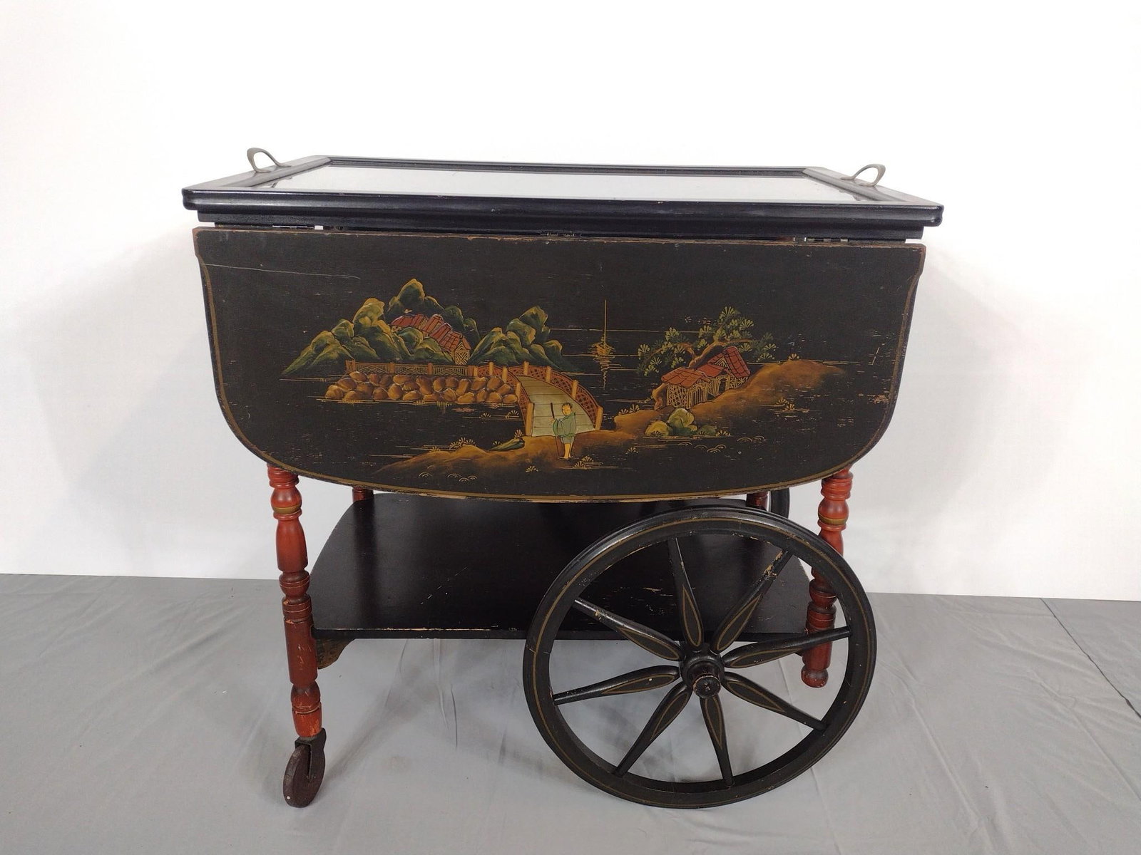 Asian Tea Cart: NOT ELIGIBLE FOR IN-HOUSE SHIPPING. Open 40", closed 18-1/4" wide X 27" deep X 29-1/2" high. Has some finish loss. Missing front handle. MG.