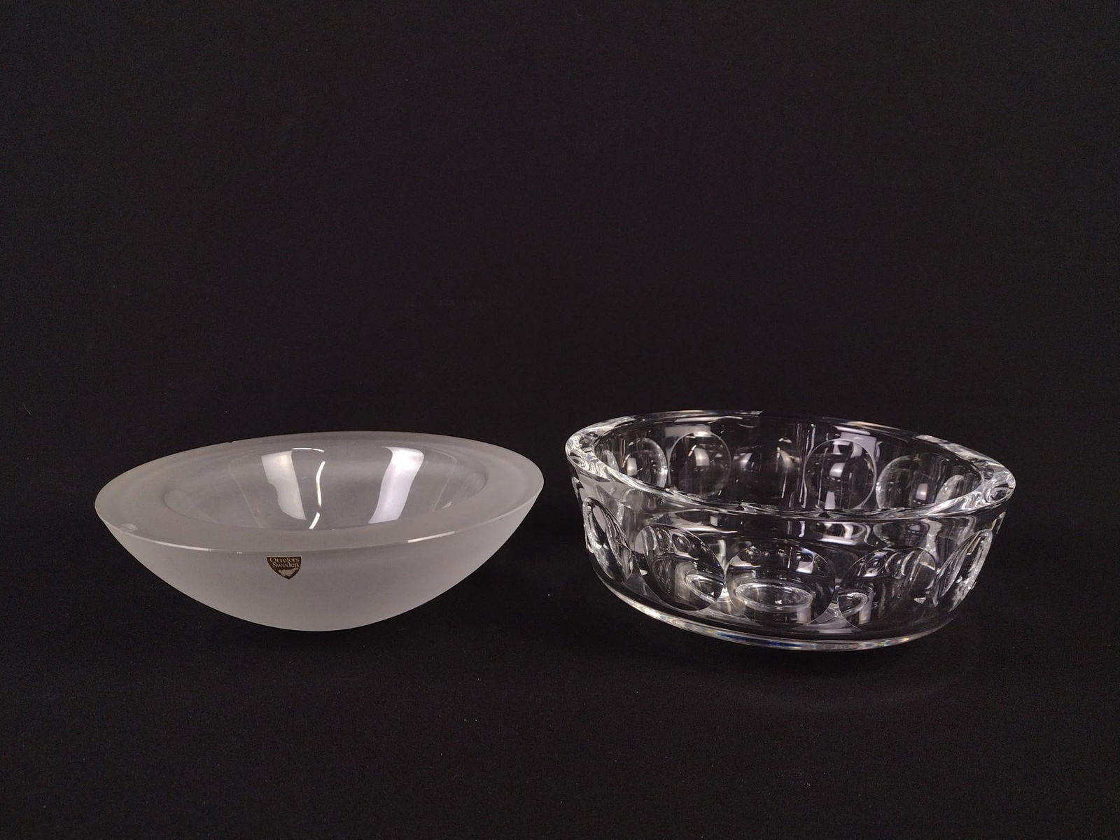 2 Orrefors Glass Bowls: Both with etched signature under base. 7-3/4" to 8" diameter x 2-3/4" to 3" high. Both with chips along top edge. LR