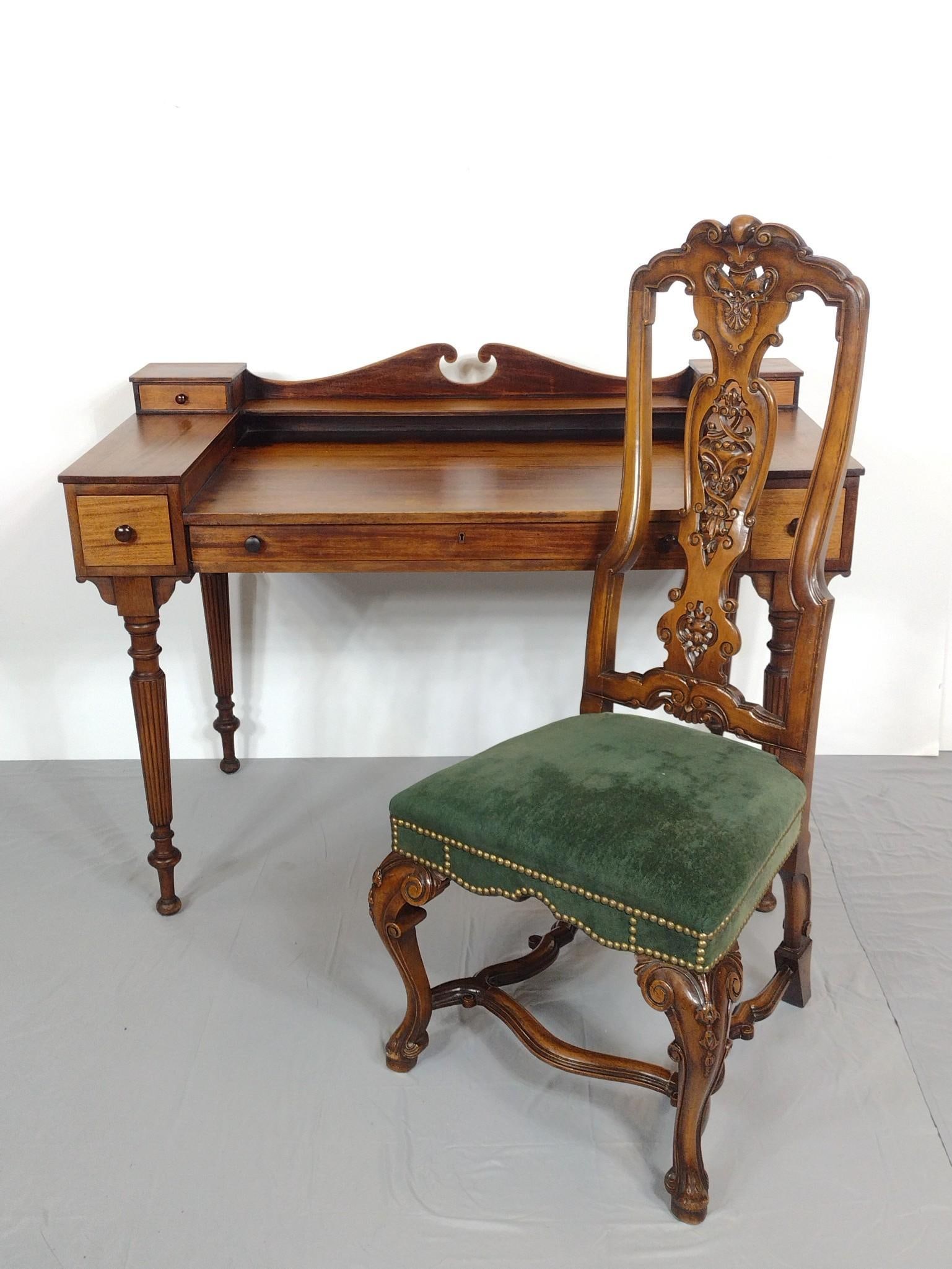 Writing Desk and Carved Chair: NOT ELIGIBLE FOR IN-HOUSE SHIPPING. Desk 48-1/2" wide X 24-1/2" deep X 34-1/2" high. Side chair with green velvet upholstery 21-1/2" wide X 21" deep X 46-1/2" high. Both have some light scratches. MG.