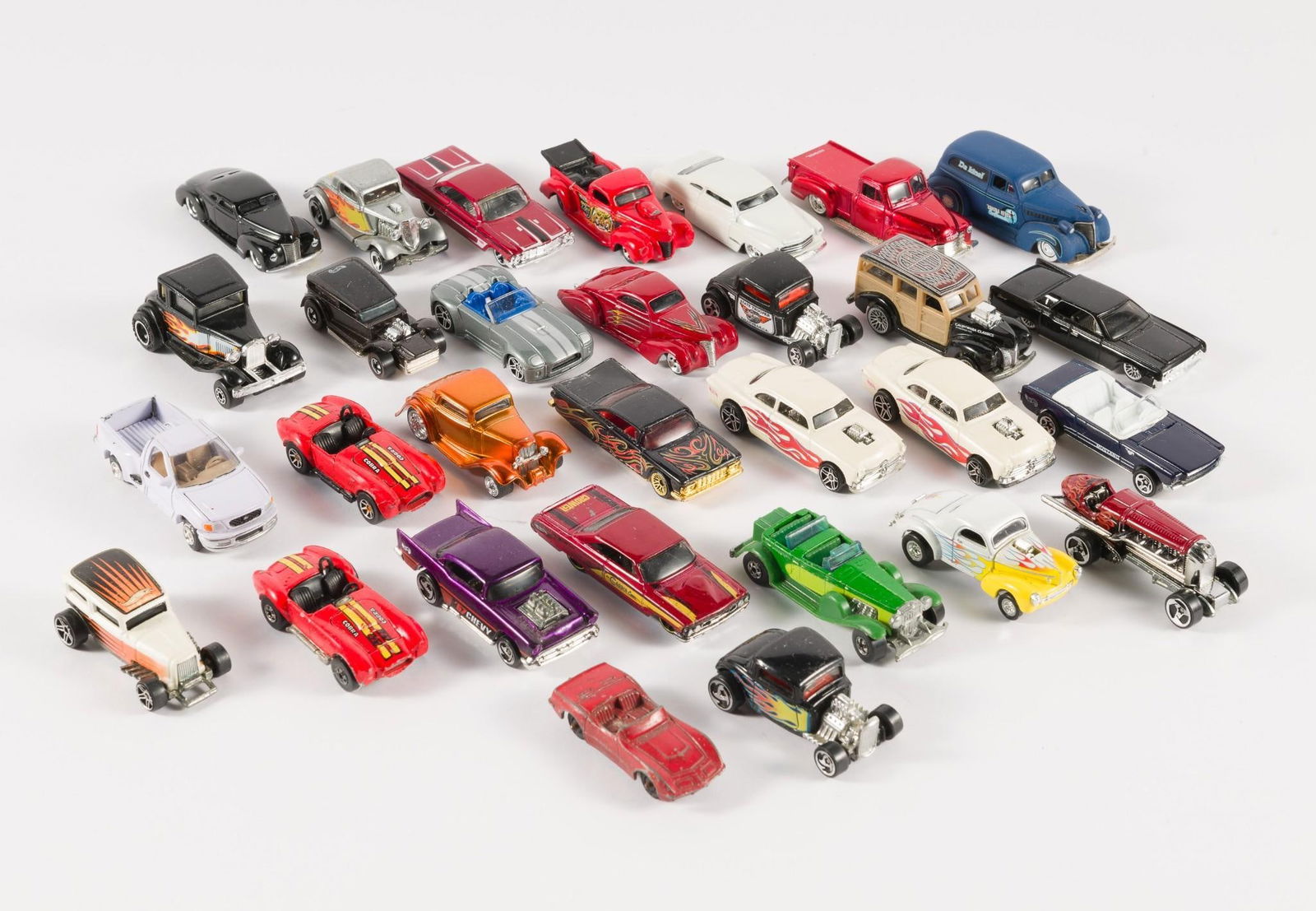 30 Matchbox and Hot Wheels Cars incl Red Line: Includes one "The Demon" 1969 Hot Wheels Red Line. Some wear consistent with age and use. All sold in as is condition.