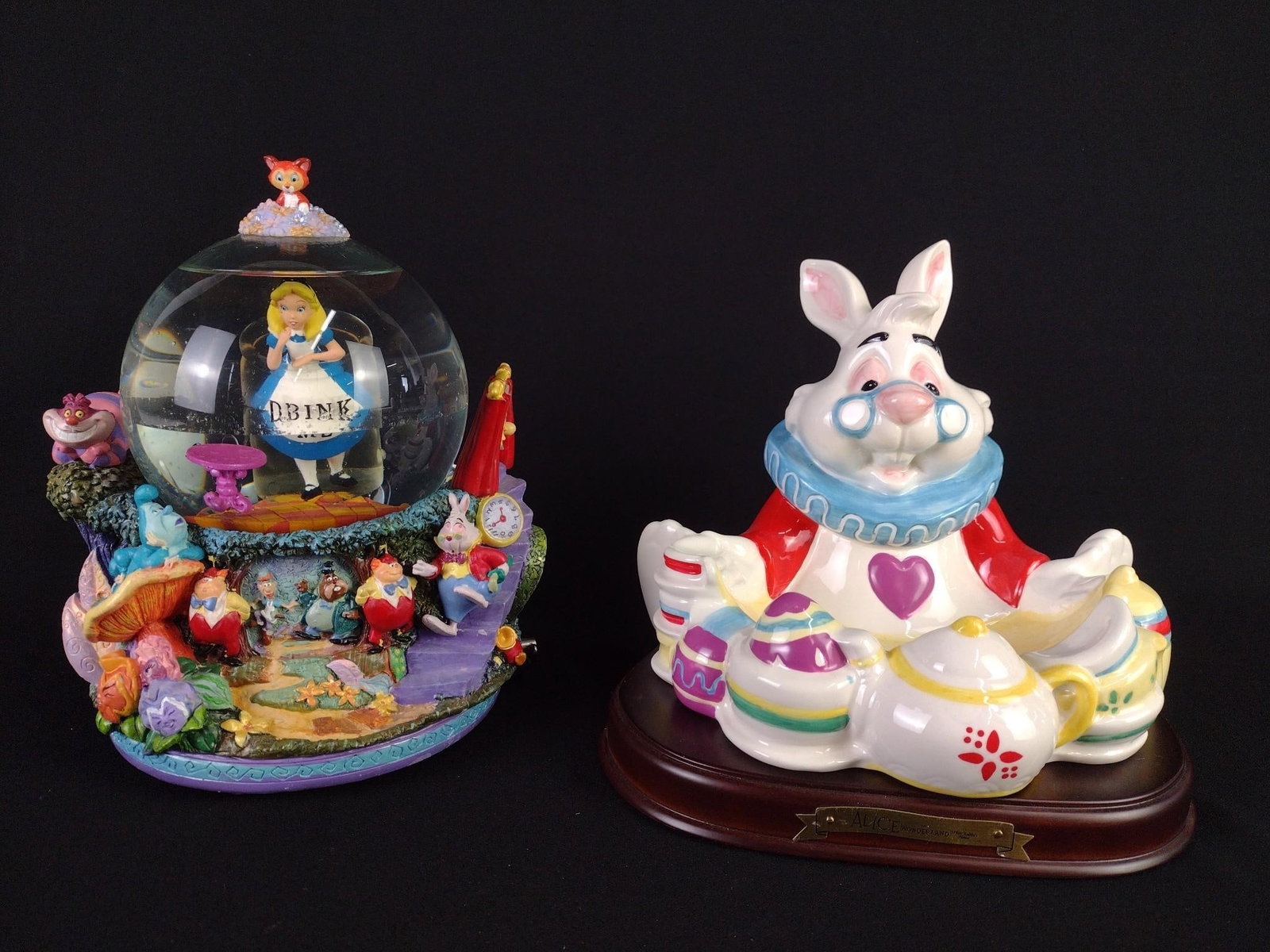 Alice in Wonderland Snow Globe and Rabbit Dish: NOT ELIGIBLE FOR IN-HOUSE SHIPPING. 7" to 8" high. Snow globe working. Globe with oily film to exterior.