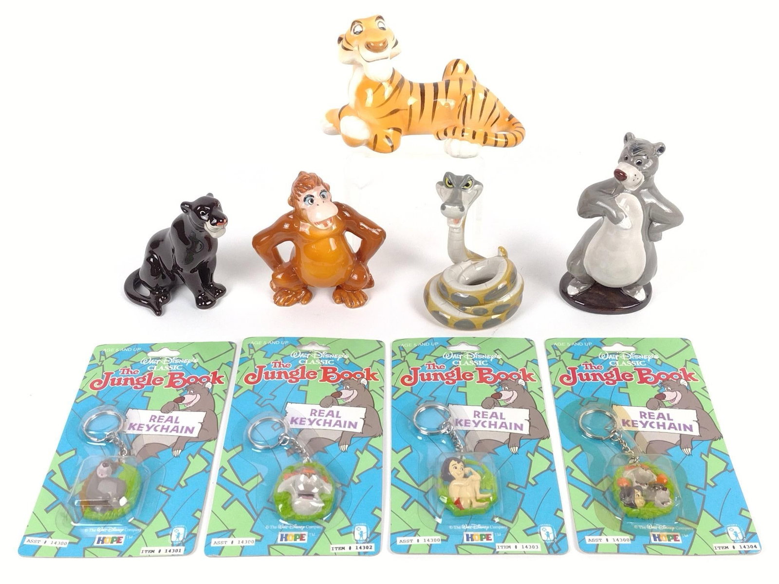 9 Pcs Jungle Book incl Figurines and Key Chains: Includes 5 figurines and 4 factory sealed key chains. 3-3/4" to 5-1/4" high.