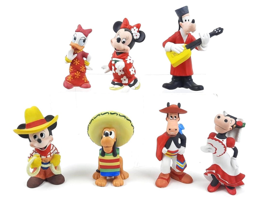 7 Mickey and Friends World Traveler Figurines: Made of ceramic. 4-1/2" to 5-3/4" high.