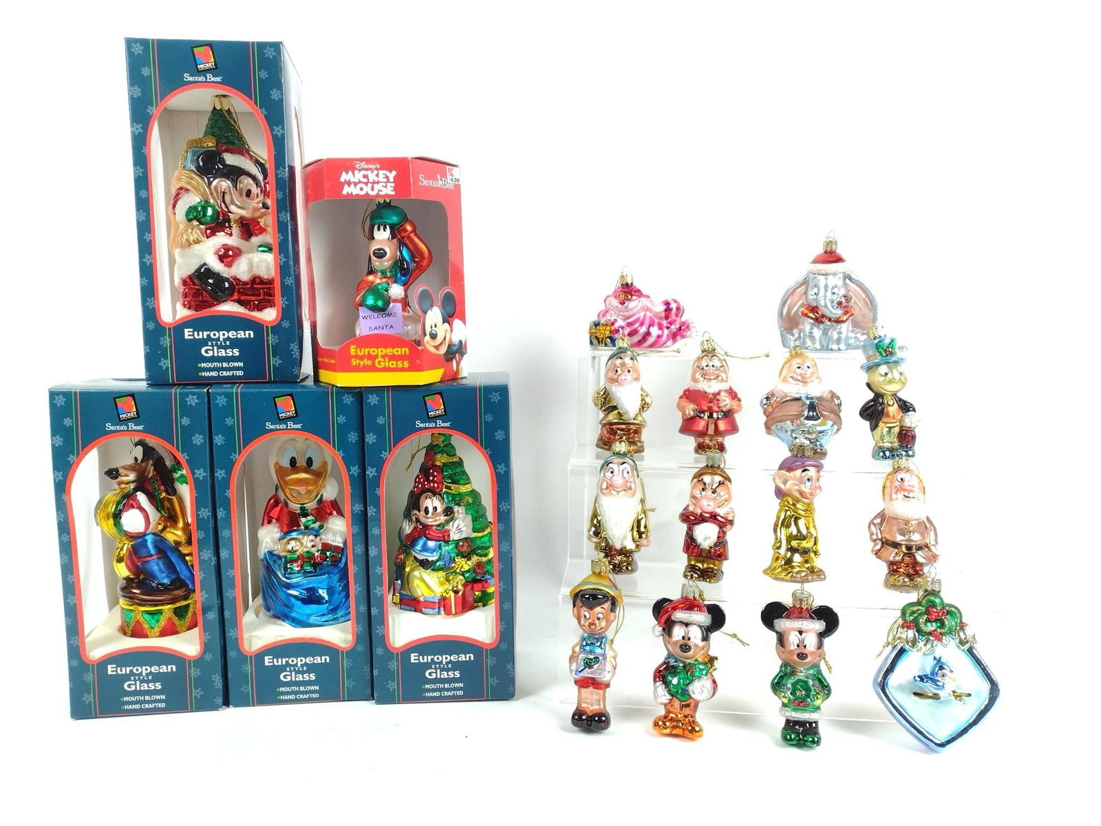 19 Disney Glass Ornaments: Includes various Disney movies including Pinocchio, Dumbo, Alice in Wonderland, Snow White and more. 4" to 9" high.