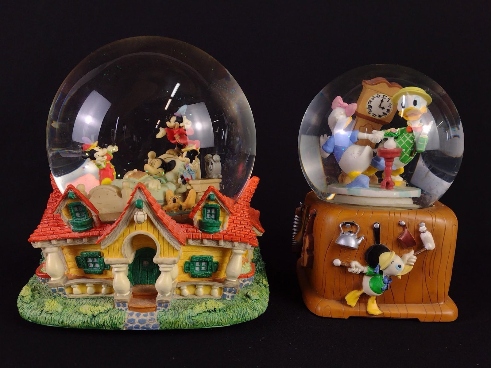 2 Mickey and Friends Snow Globes: NOT ELIGIBLE FOR IN-HOUSE SHIPPING. Includes 1.) "When You Wish Upon a Star" Mickey snow globe. Working. 2.) "In the Mood" Donald and Daisy Duck dancing. Working. 7" to 7-3/4" high.