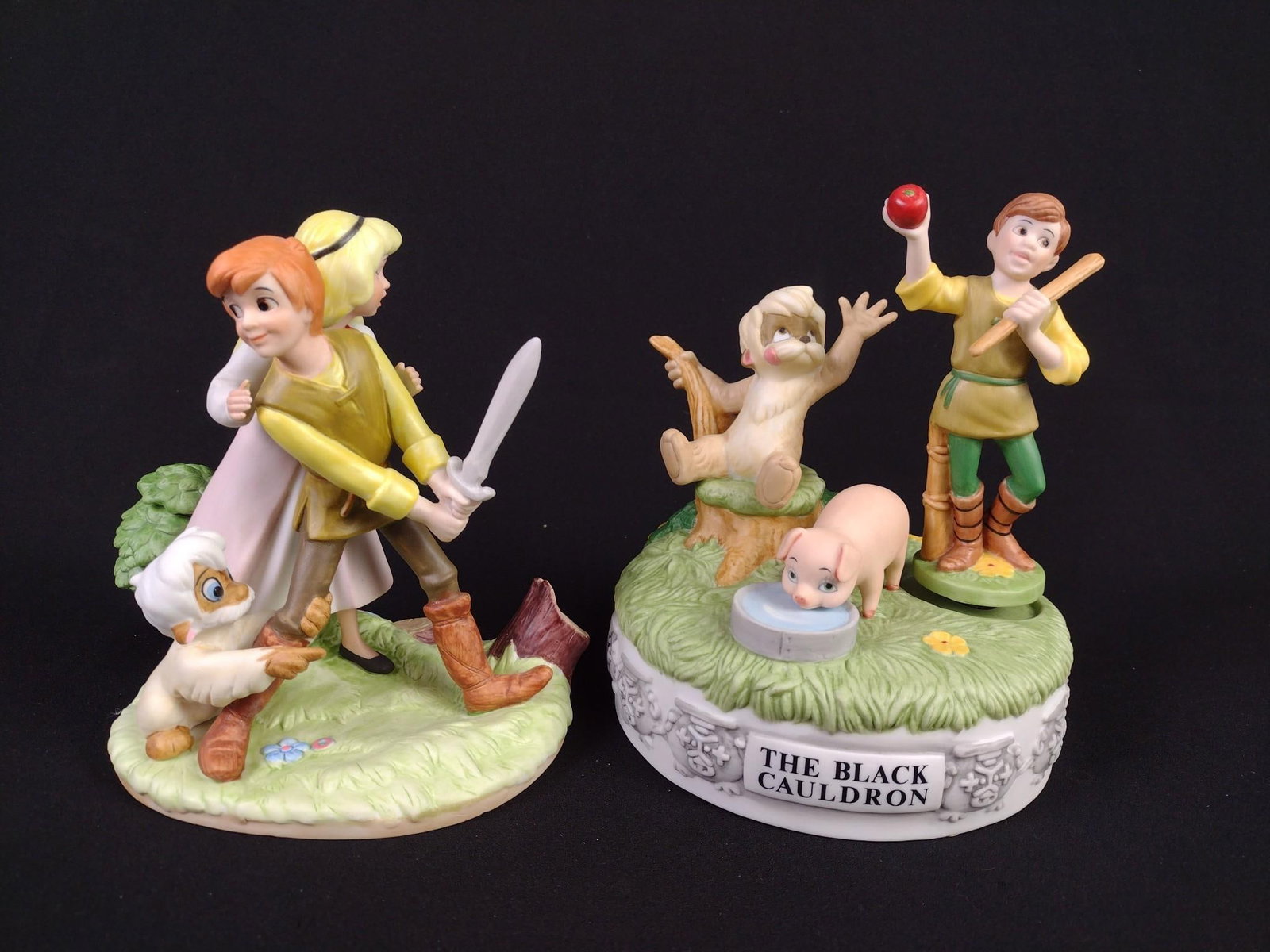 2 The Black Cauldron Disney Figurines: Includes 1.) Magic memories the black cauldron limited edition figurine. Edition number 5,414 / 15,000. 2.) Musical memories the black cauldron figurine. Edition number 4,678 / 19,750. 6" to 7" high.