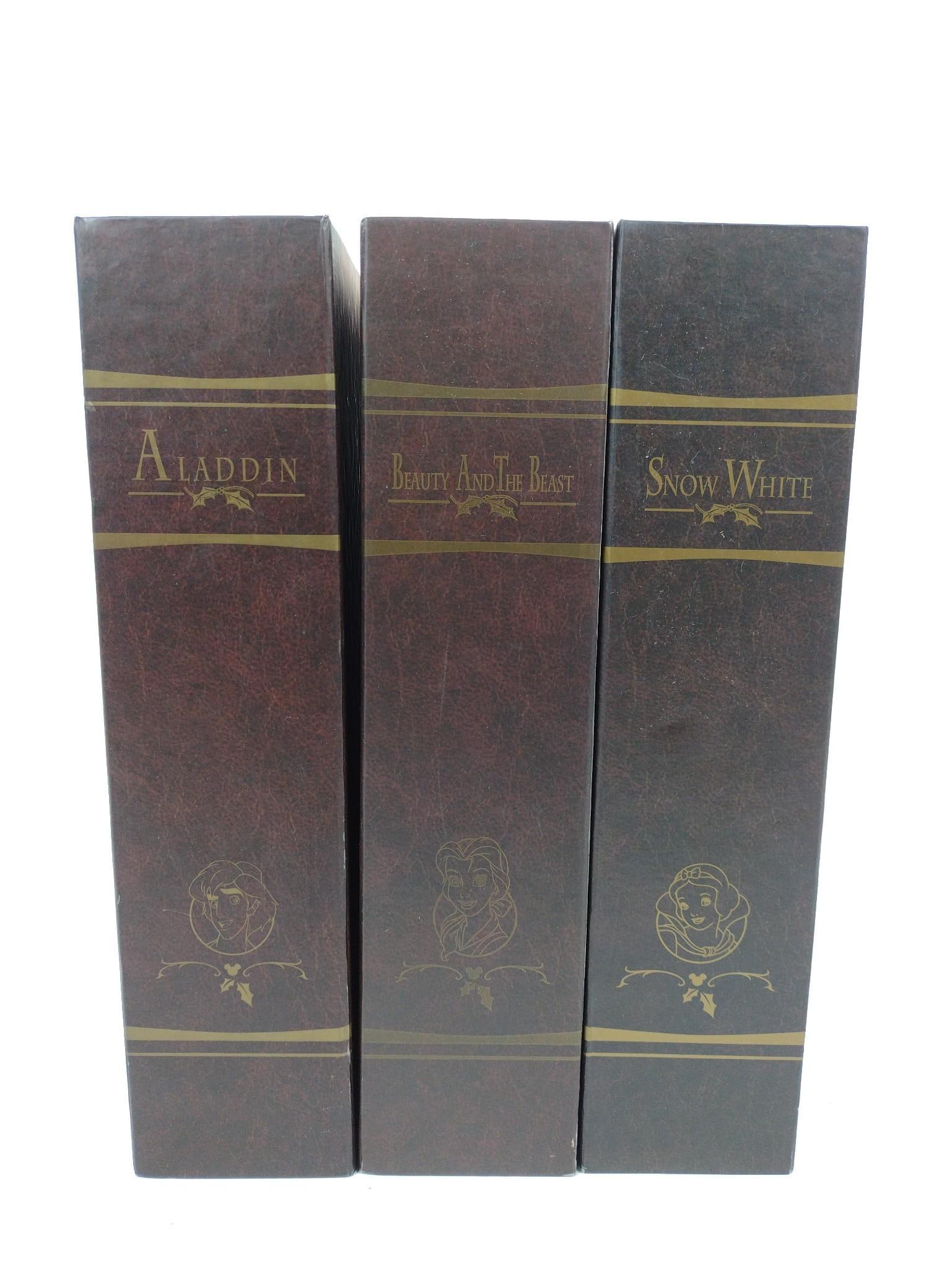 3 Disney Ornament Storybooks: Includes 1.) Snow White number 14523. 2.) Beauty and the Beast number 16143. 3.) Aladdin number 16144. All with some wear to boxes.