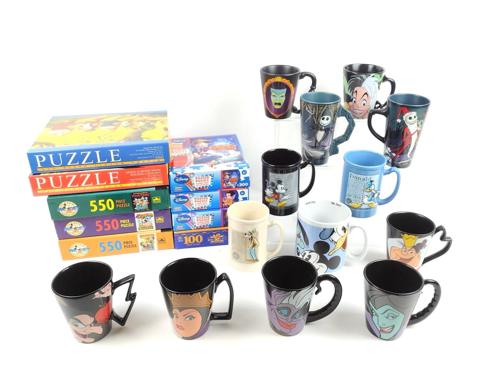 22 Disney Puzzles and Mugs incl Villians: Puzzles all new in box.