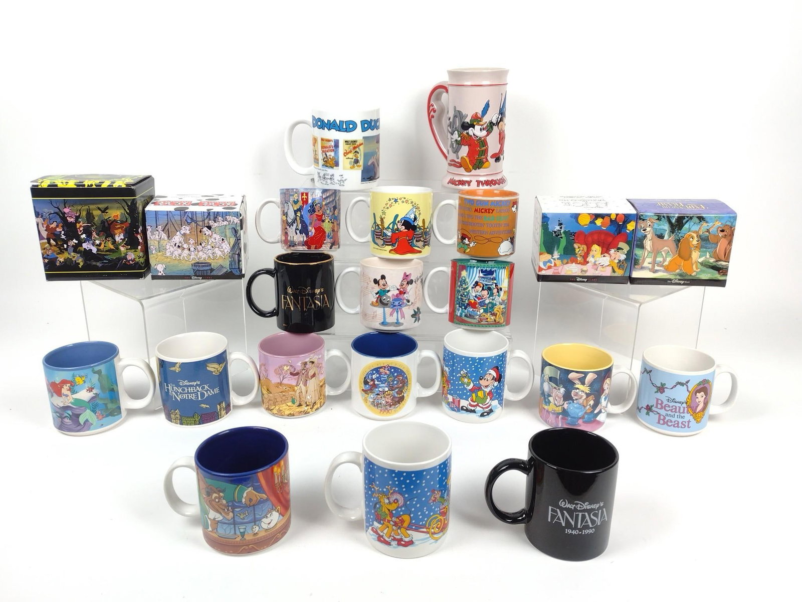 22 Disney Mugs incl Alice in Wonderland: Also includes Lady and The Tramp, The Villians, and more. 3-1/2" to 6" high.
