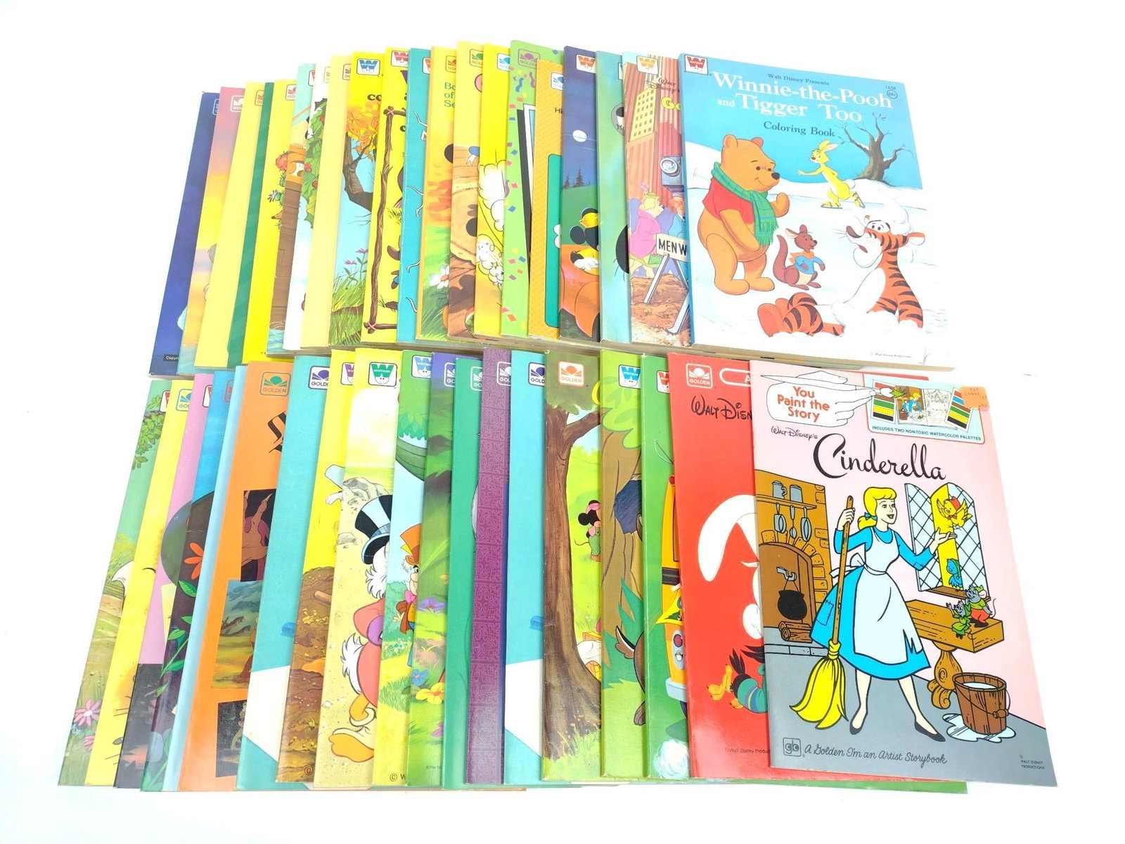 40 New Old Stock Disney Coloring / Activity Books: Includes Winnie The Pooh, Peter Pan, The Lion King, and more.