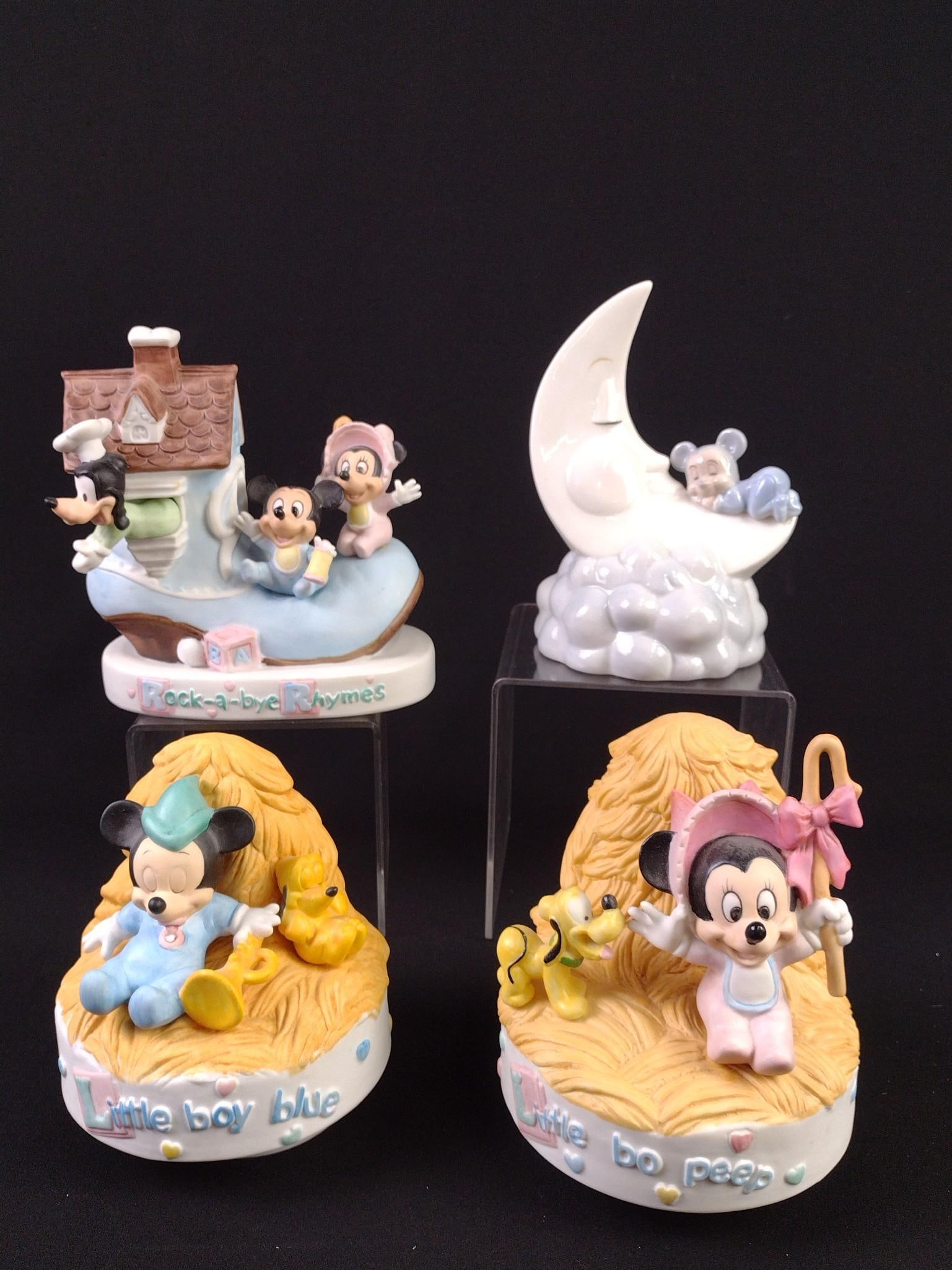 4 Baby Mickey Mouse and Friends Figurines: Includes musical figurines and piggy bank. All musical figurines working. 5-1/2" to 6-3/4" high.