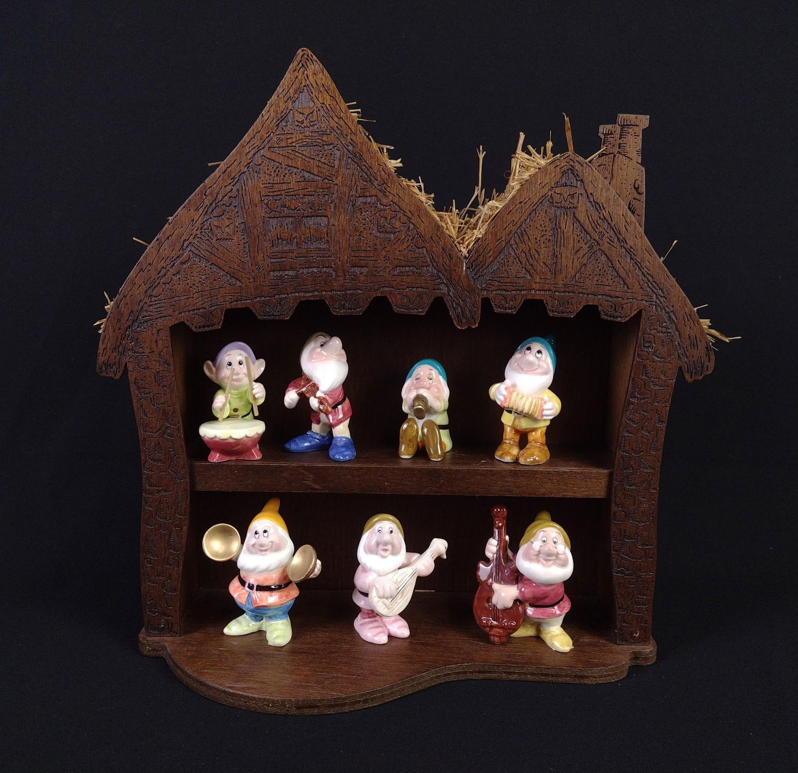 Seven Dwarfs Figurines on Shelf: 2-1/4" to 3" high. Cottage shelf: 13" wide x 12-1/4" high.