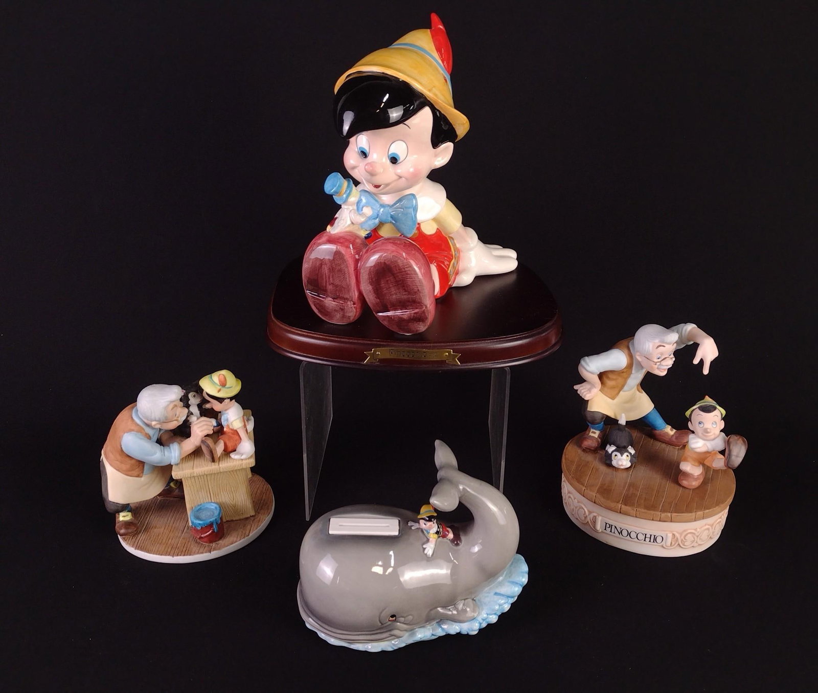 4 Pinocchio Figurines incl Ltd Ed: Includes 1.) Magic Memories Pinocchio limited edition figurine. Edition number 5,995 / 15,000. 2.) Musical Memories Pinocchio limited edition figurine. Edition number 12,653 / 19,750. Working. 3.) Sch