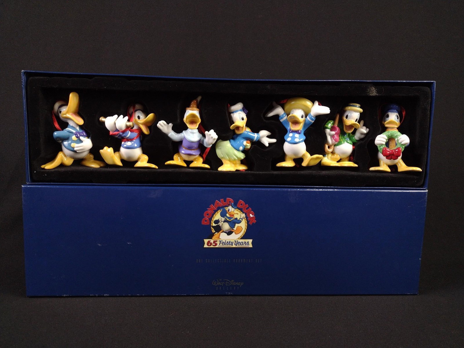 7 Pc "Feisty Years of Donald Duck" Figurines: Each approximately 3" high. Includes original box.