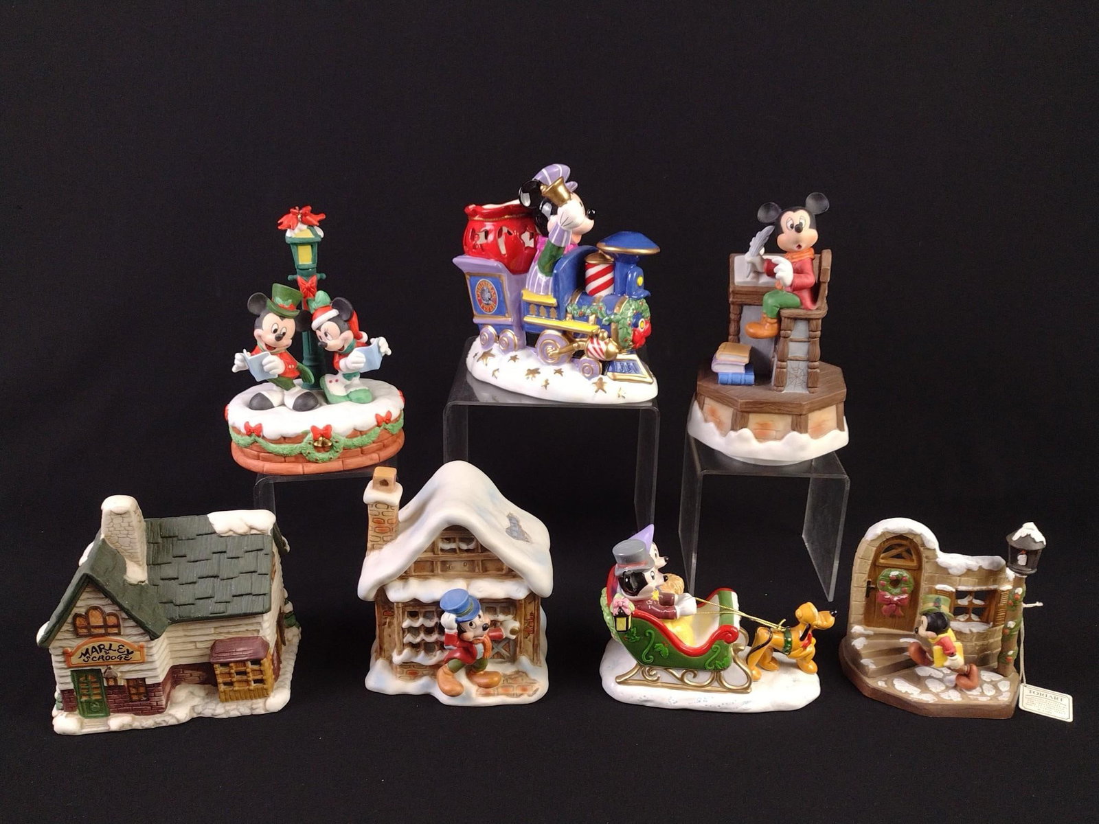 7 Disney Christmas Figurines incl Musical Schmid: 4" to 8" high.