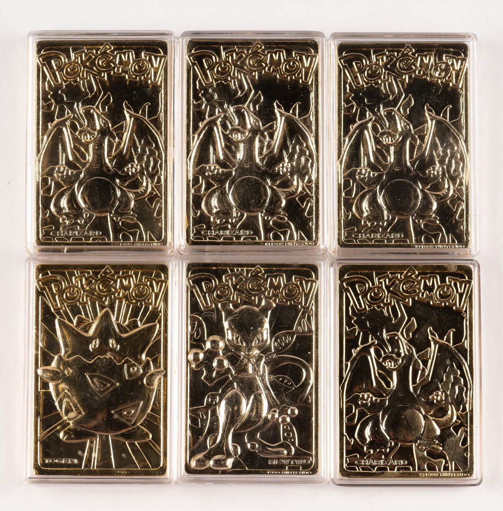 Pokémon Gold Plated Medallion Cards: (4)Chizard, (1) Togepi, (1) Mewtwo. 2 3/4" x 1 3/4"