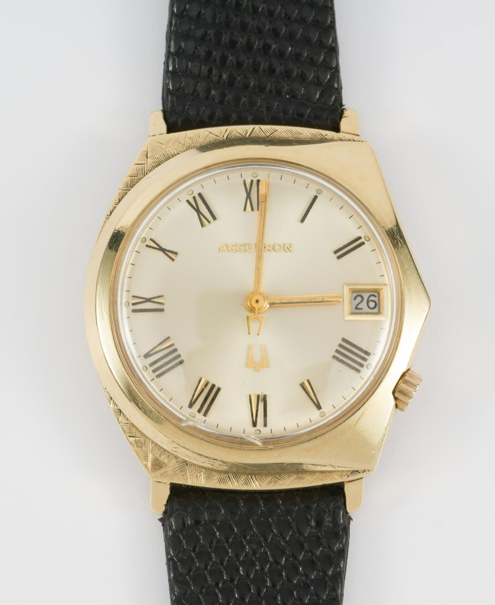 Bulova Accutron 14K Gold Eccentric Case: Running and keeping time for several weeks since we put a battery in the watch. 14k case has scratches and wear. Advancing the date function by using the crown apparently is not working correctly but