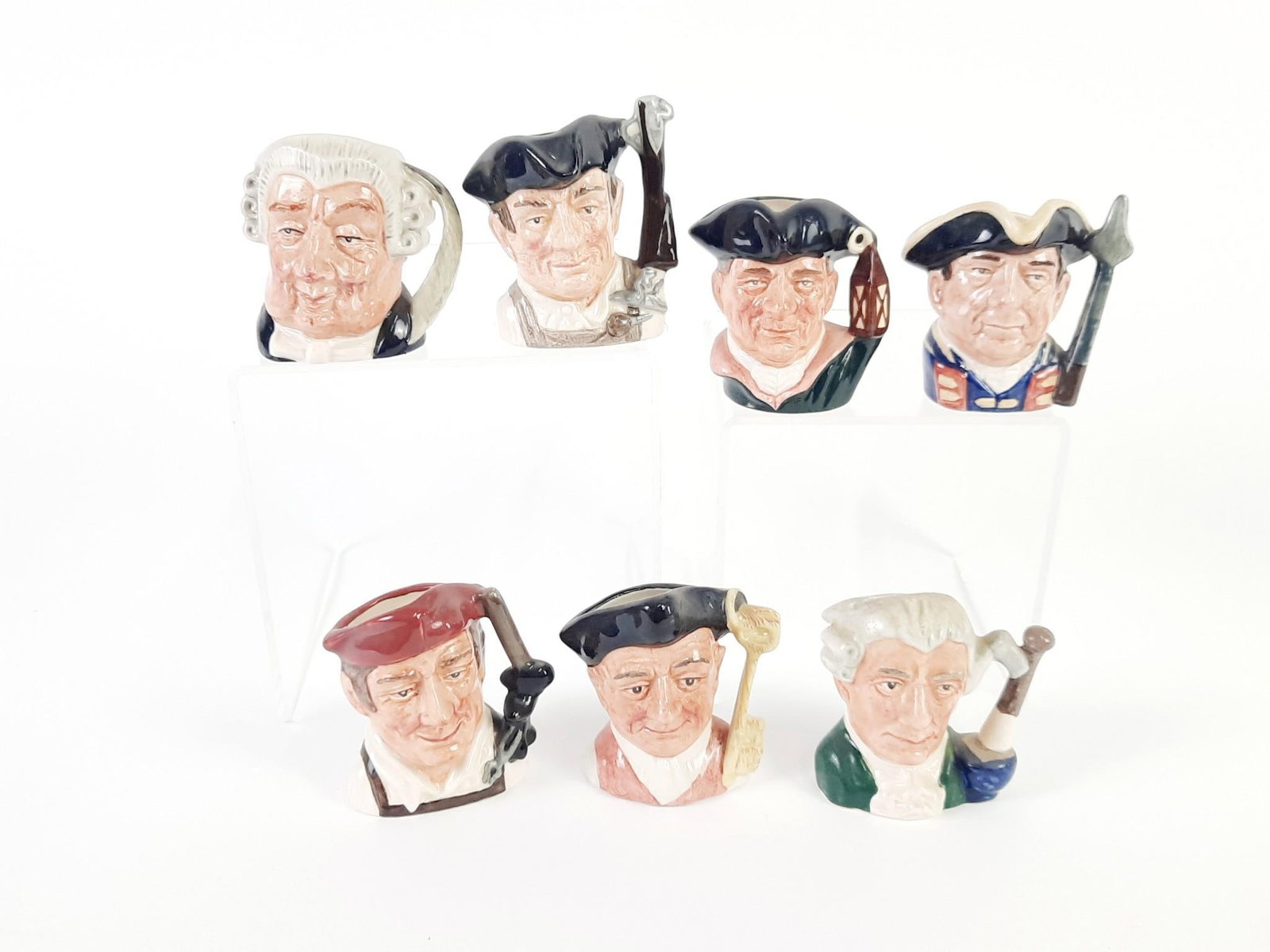 7 Miniature Royal Doulton Toby Mugs: Each approximately 2-3/4" high.