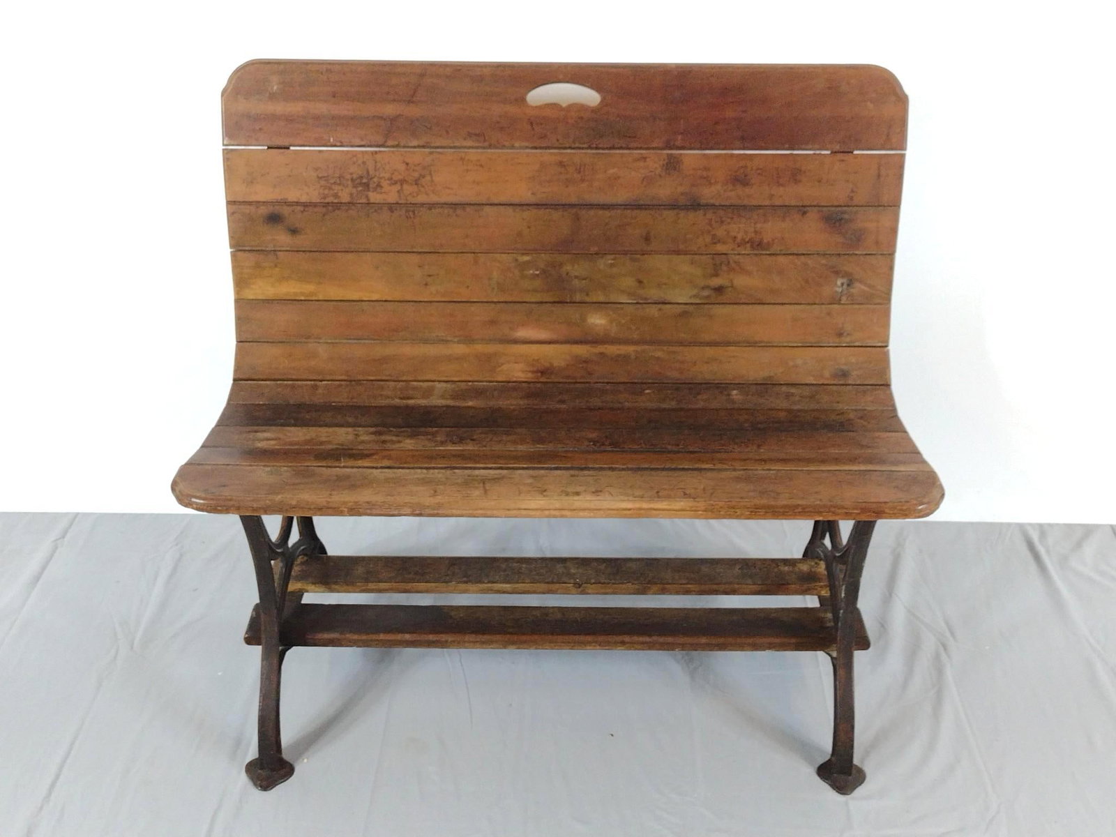 Cast Iron & Wood Bench: NOT ELIGIBLE FOR IN-HOUSE SHIPPING. 33" wide X 18-1/2" deep X 29-1/4" high. Has wear. No manufactures name found.