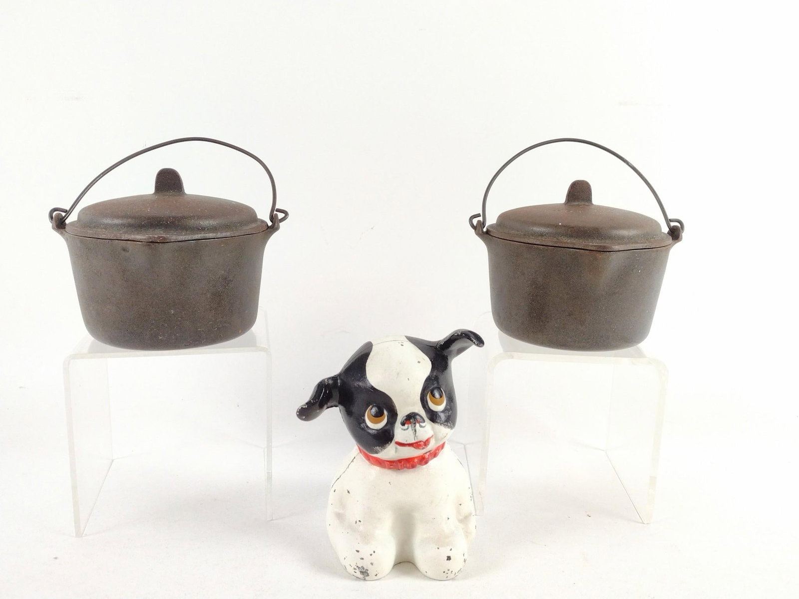Cast Iron Dog and 2 Wagner Miniature Dutch Ovens: Dog: Unmarked. 3" wide X 4" deep X 5" high. Wagner miniature dutch ovens: 5" diameter X 3-3/4" high.