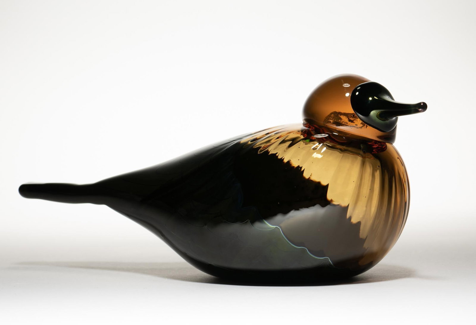 Oiva Toikka Pacific Water Fowl 2005: DESCRIPTION: Produced for the Takoma Museum of Glass iitala event. 1177/1250. Original iitala box. Changes color from brown to green in different lighting. MEASUREMENTS: 9 1/2" X 3 1/2" X 3 3/4". COND