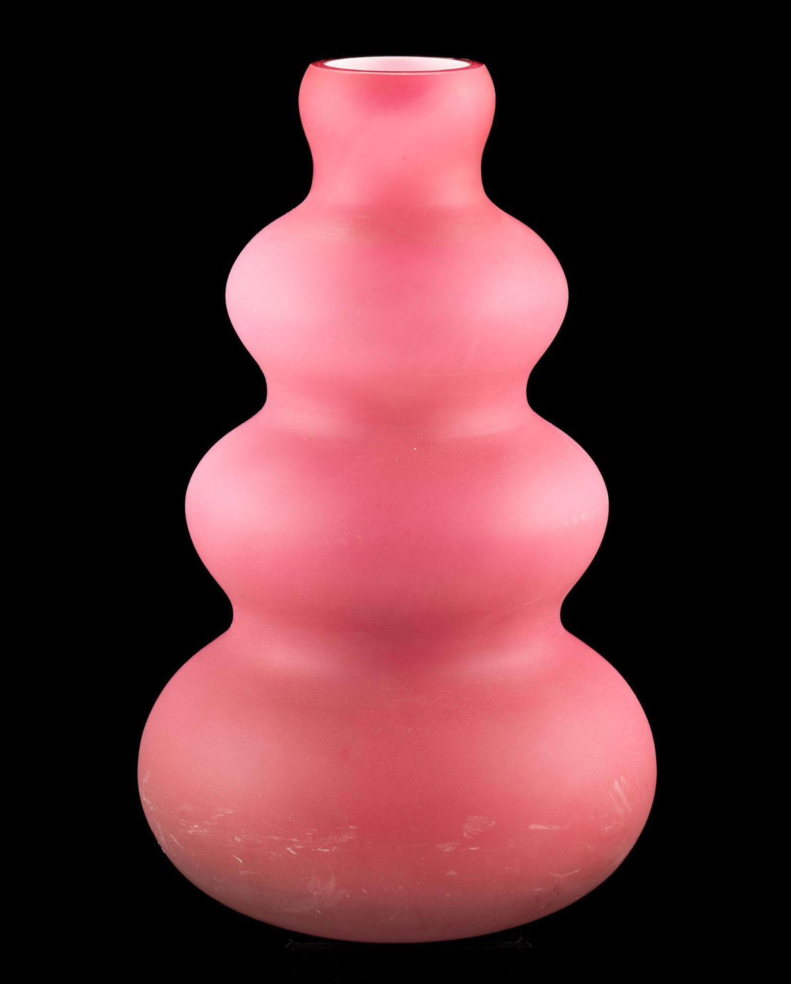 Pink Orrefors Vase: DESCRIPTION: Pink Orrefors vase. Matte finish. Since 1898, art and crystal glass for everyday use has been produced under the brand of Orrefors. Manufacuturer sticker. MEASUREMENTS: 7-3/8" diameter x