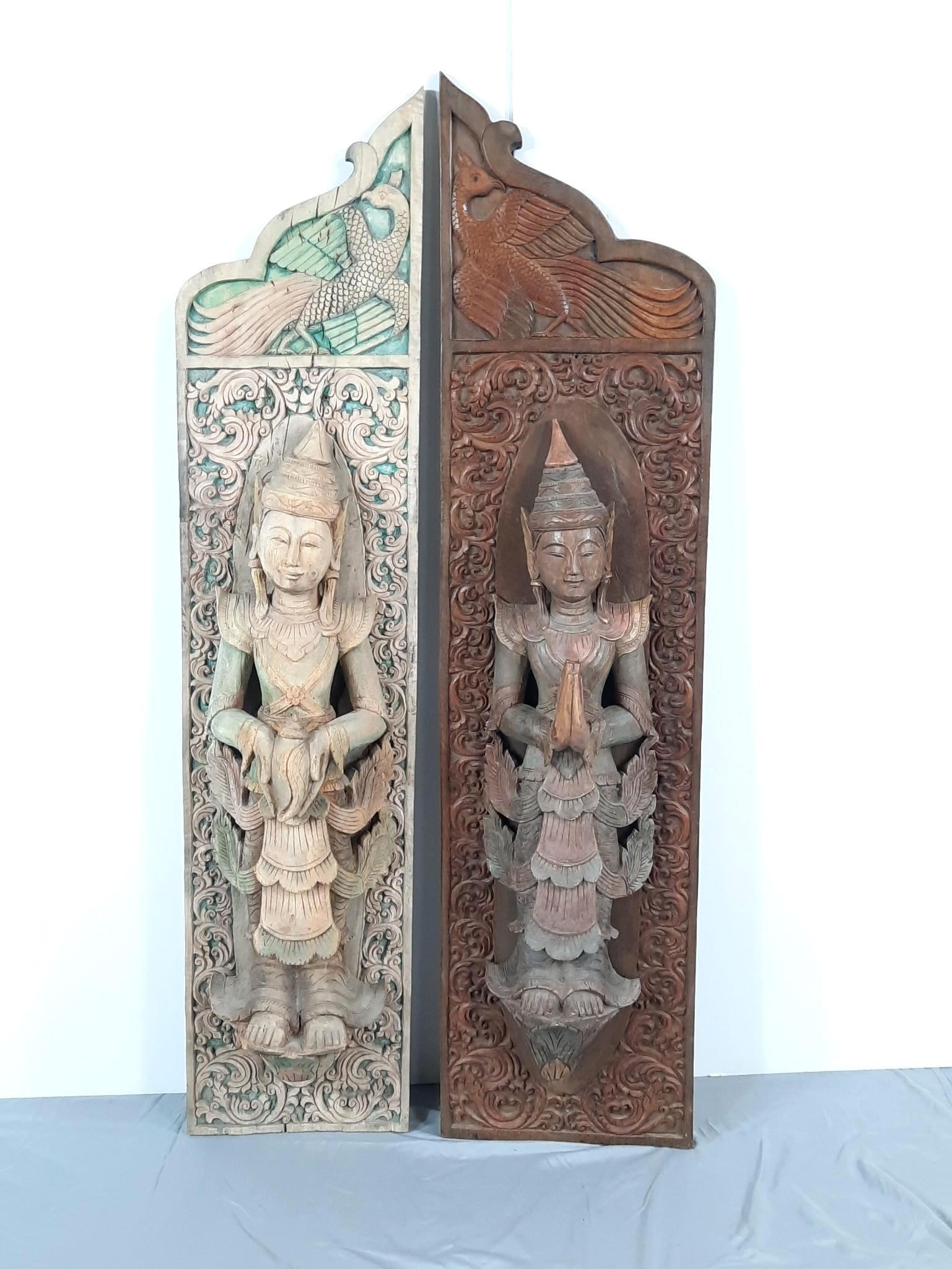 Pair of Thai Carved Wood Polychrome Wall Panels: NOT ELIGIBLE FOR IN-HOUSE SHIPPING. 55” high x 12” wide. Left sun faded. PROVENANCE: From the Estate of James L. Stanfield, Veteran National Geographic photographer (1937-2023). Mr. Stanfi