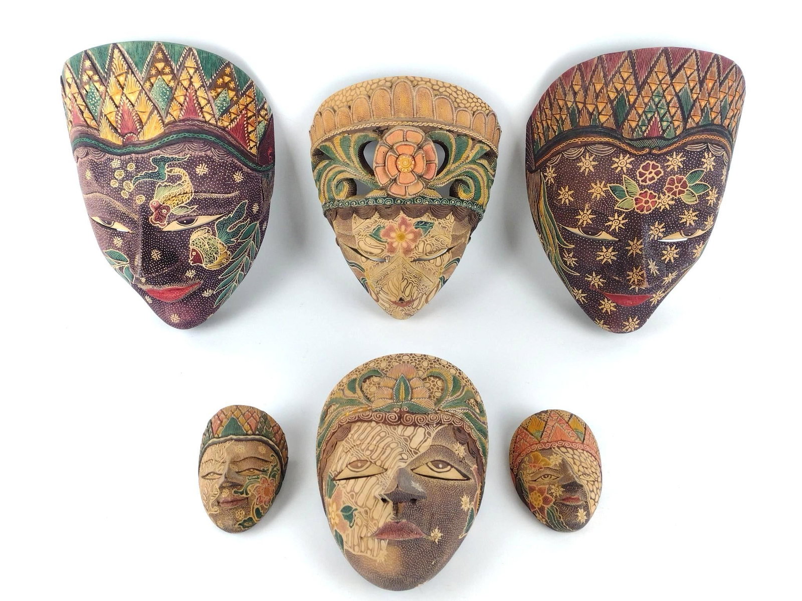 6 Indonesian Wood Carved Masks: 3" to 8" wide x 2-1/2" to 5" deep x 4-1/4" to 10-3/4" high. PROVENANCE: From the Estate of James L. Stanfield, Veteran National Geographic photographer (1937-2023). Mr. Stanfield was one of the world'