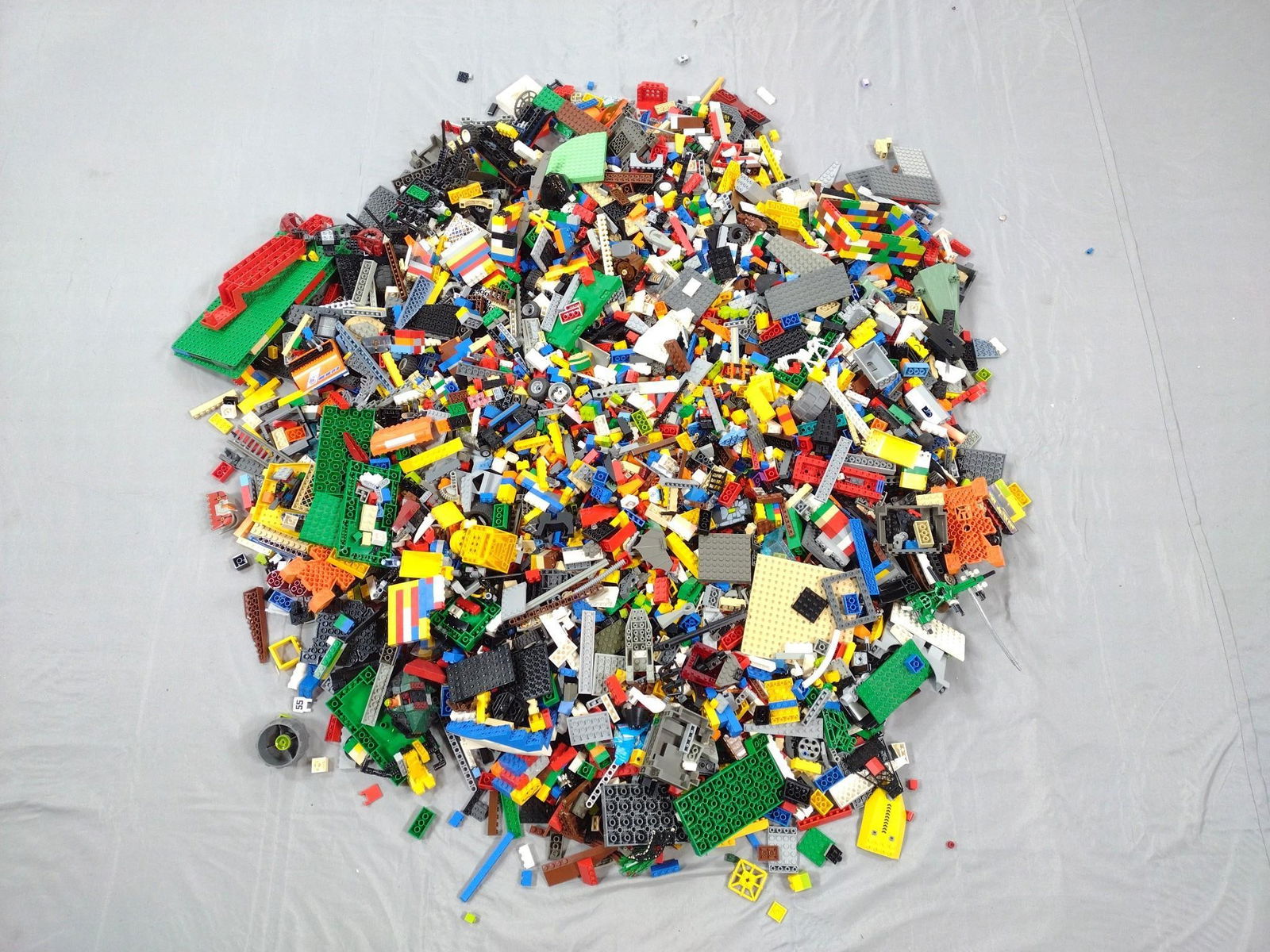 25 Lbs Legos: Various parts and pieces. May include non-Lego pieces.