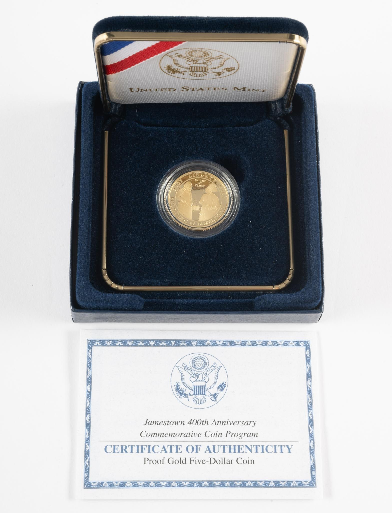 Jamestown 400th Anniversary Gold Coin: Five Dollar gold 2007 coin with boxes and papers.