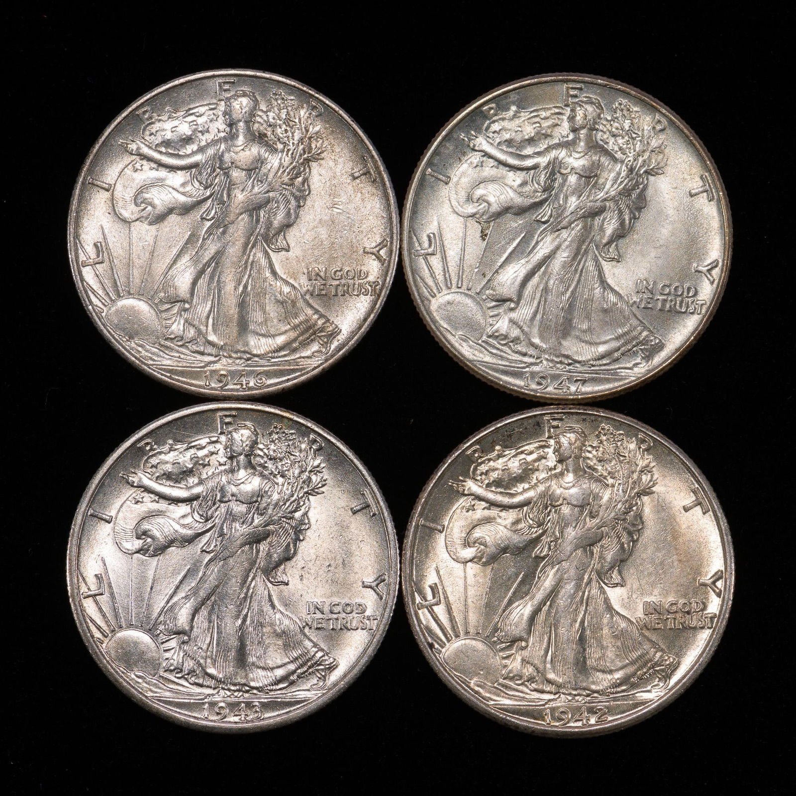 Four Uncirculated or AU Walking Liberty Silver Half Dollars (1 of 2)