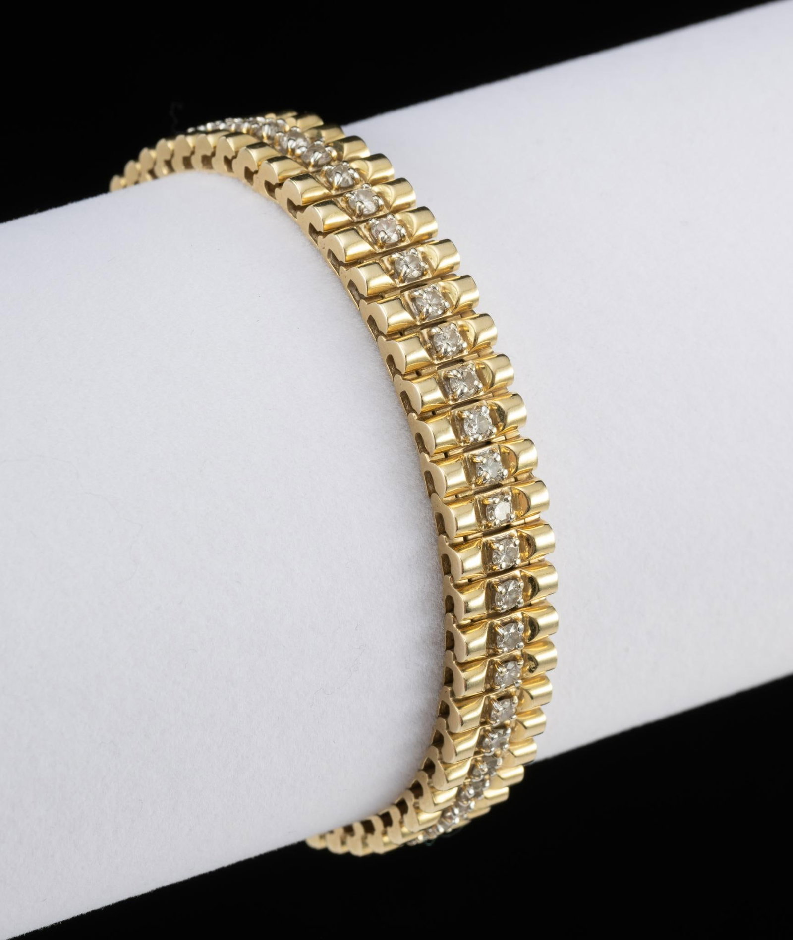 14K Gold and Diamond Tennis Bracelet: Tennis bracelet with fifty-five round full cut diamonds, total of approximately 3 carats. Clarity SI2, Color H-I. 29.1 grams. 7" long.