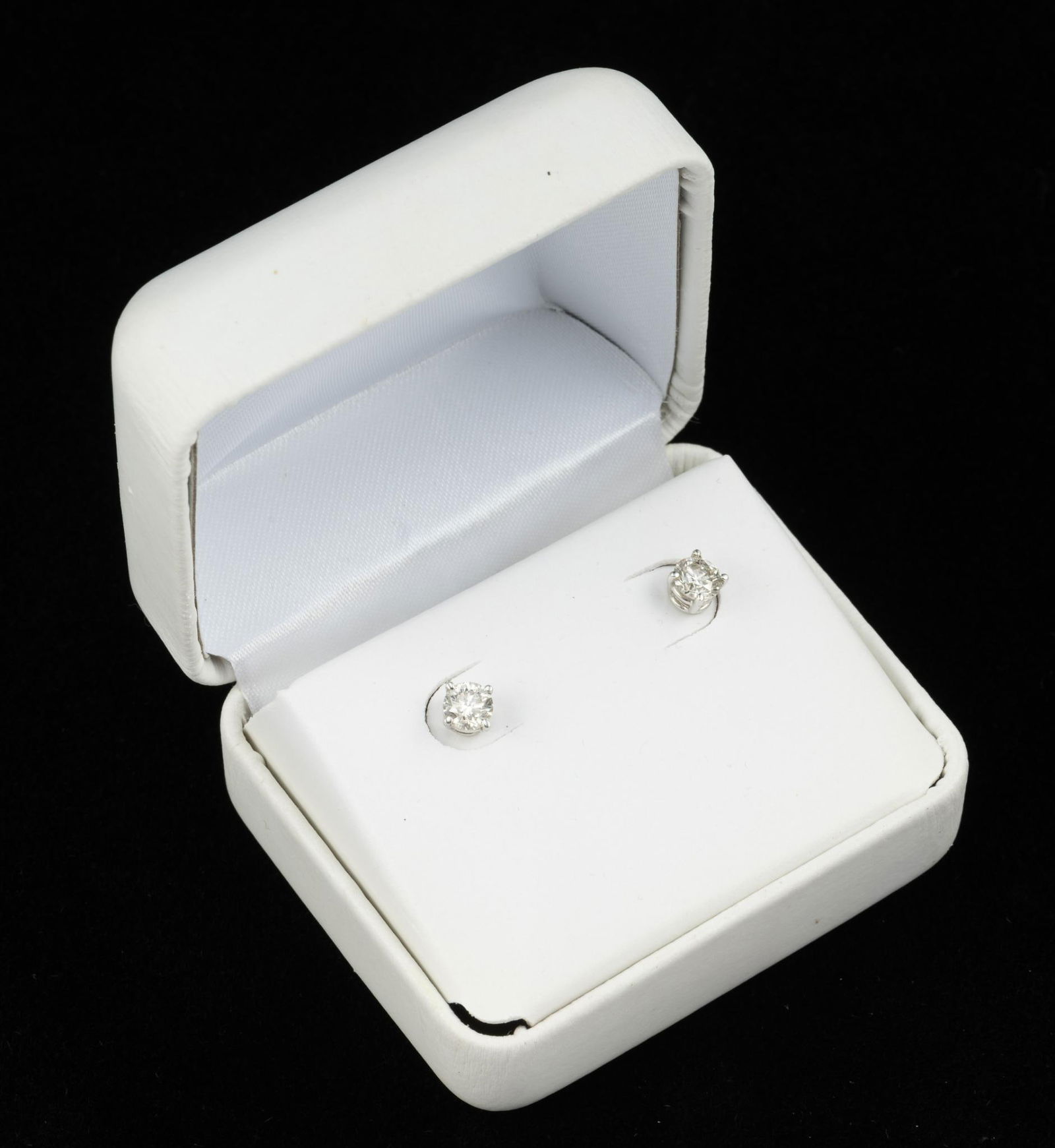 14K Gold and Diamond Stud Earrings: Pierced stud earrings each with approximately .45 carat diamond. Clarity I1, Color J-K.