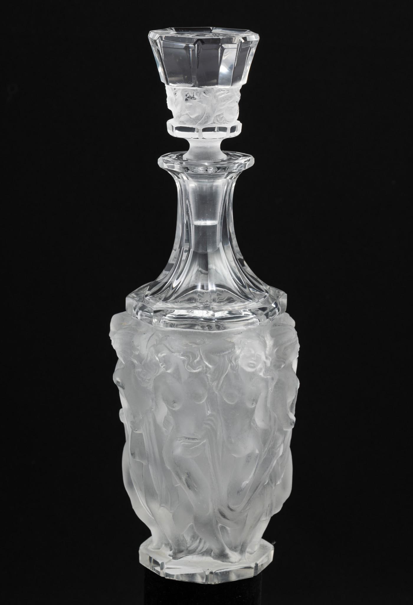 Lalique Bacchantes Decanter: 4" diameter x 10-3/4" high. "#438 etched under stopper".