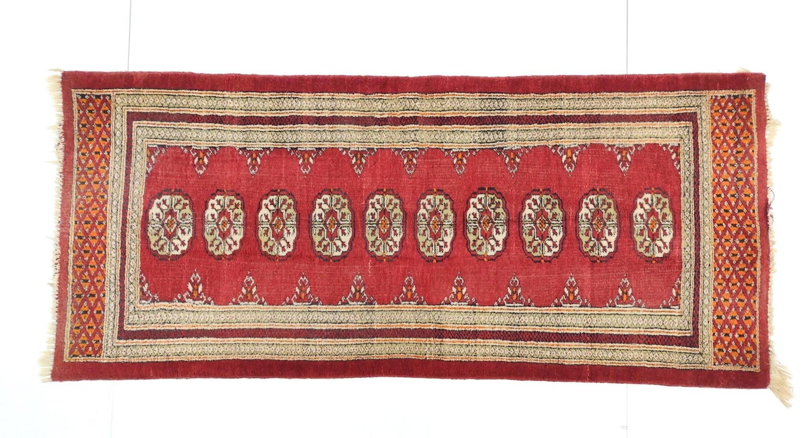 Bokhara Area Rug: NOT ELIGIBLE FOR IN-HOUSE SHIPPING. Geometric ends. 5'7" long X 2'5" wide. Loss to fringe.