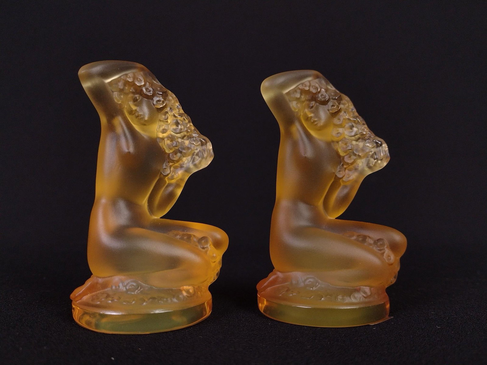 2 Lalique Coffret Floreal Statuettes: Amber glass. Each with original box. Each 2" wide x 1-3/4" deep x 3-1/4" high.