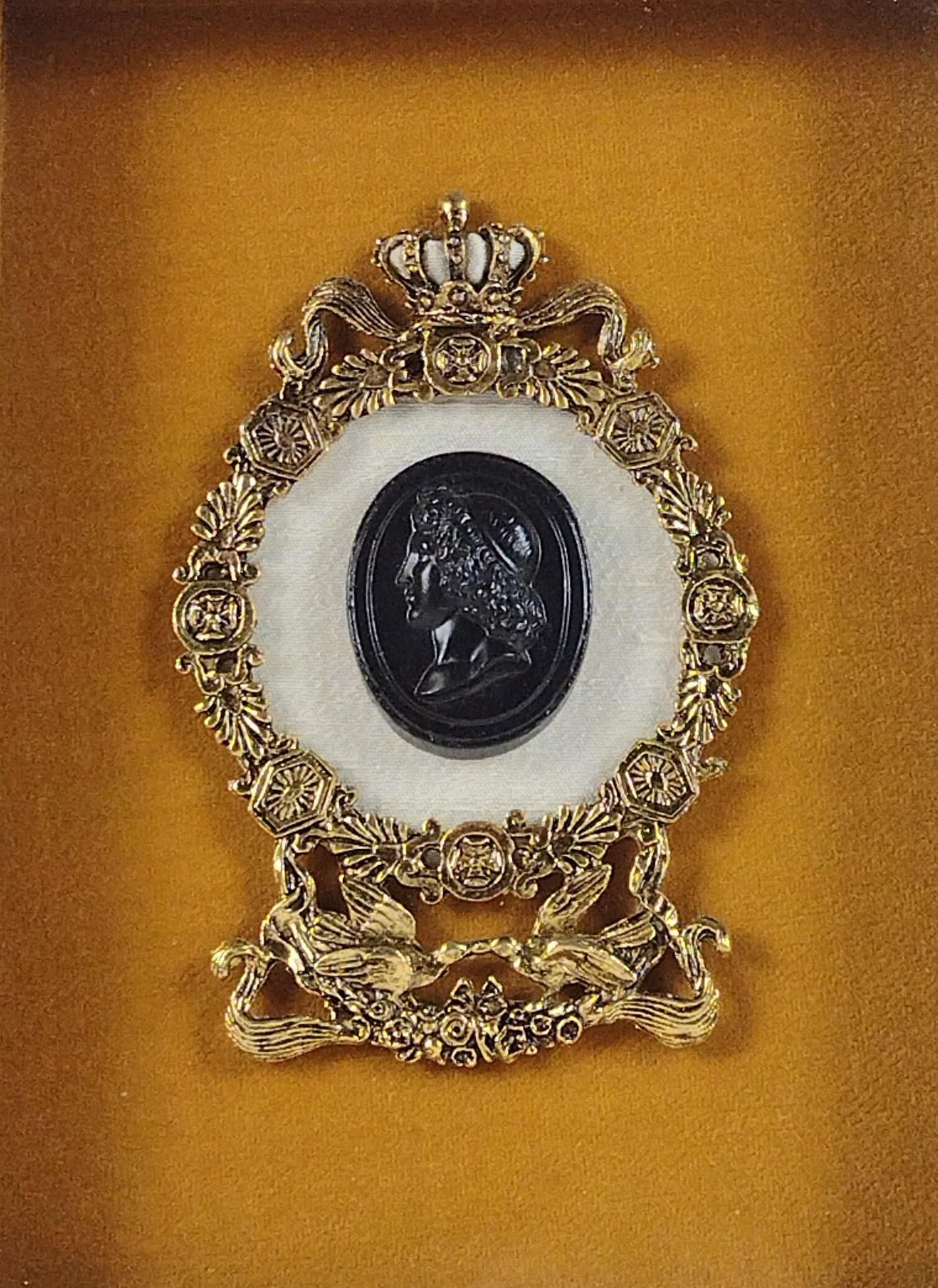 Jet Black Mourning Cameo: Reproduction of original. Cameo: 1-3/4" high x 1-1/4" wide. Overall with frame: 12" high x 10" wide. Some scratches to frame.