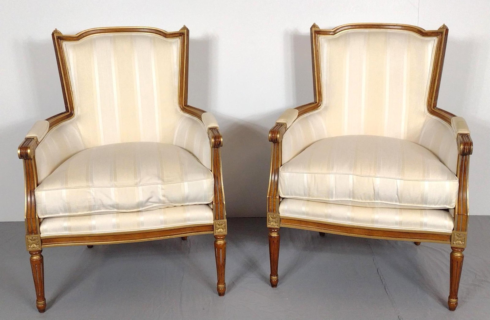 Pair Of Louis XVI Style Century Arm Chairs: NOT ELIGIBLE FOR IN-HOUSE SHIPPING. Each 29-1/2" wide X 25" deep X 41" high. One chair has some discoloring to arm rests.