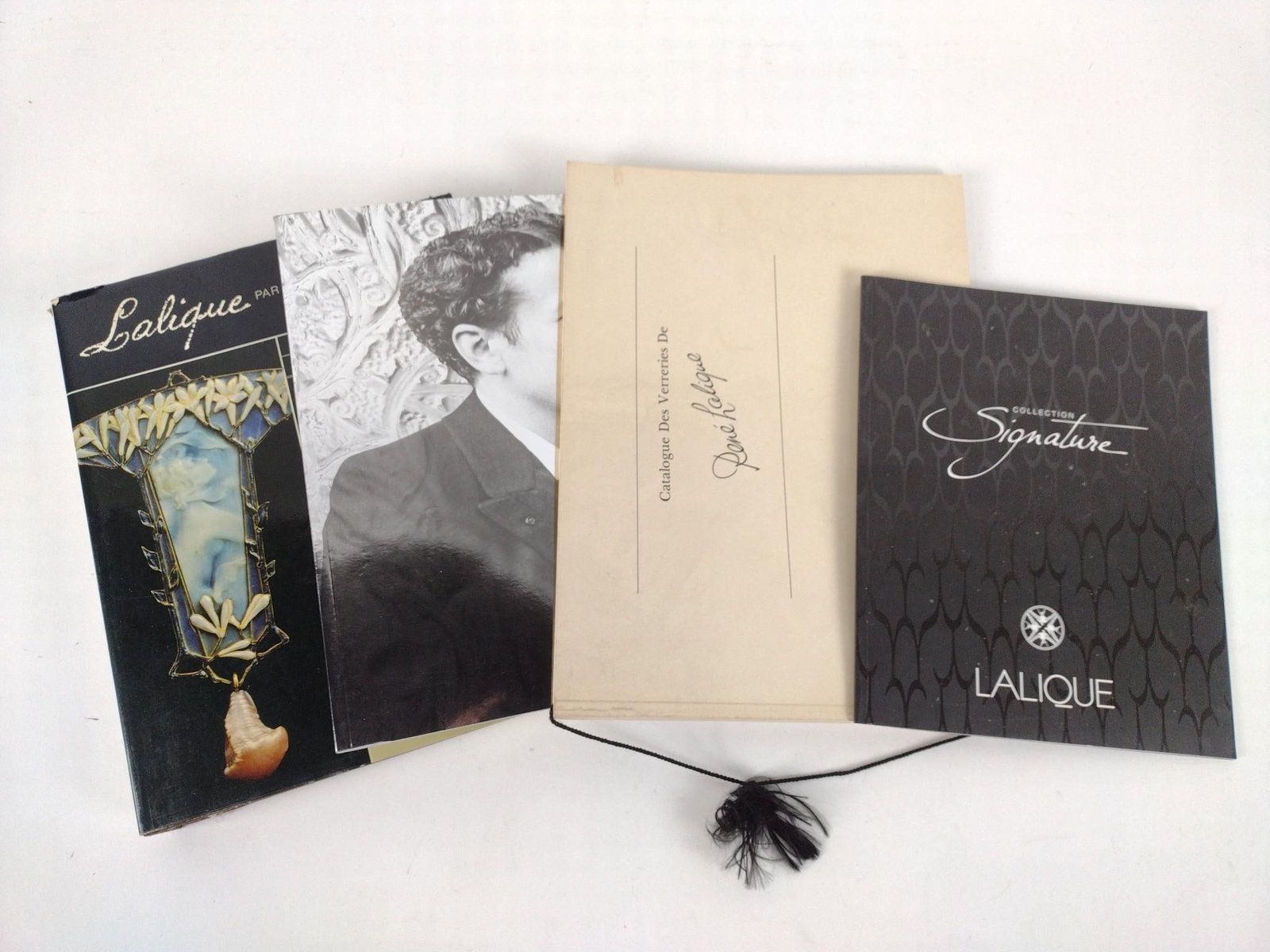3 Lalique Catalogs and Lalique Book: Catalogs are all soft cover. Also includes hardback book.