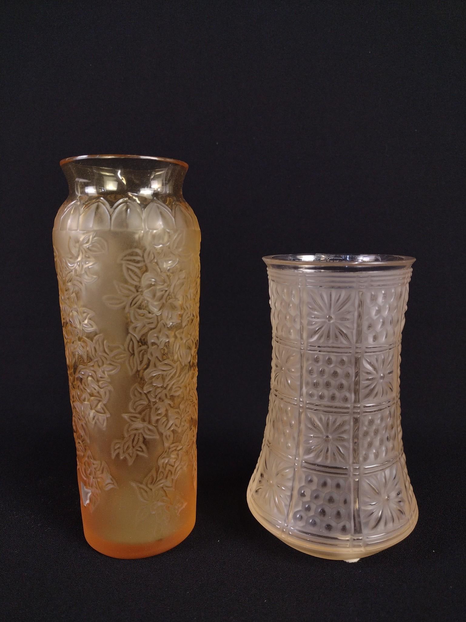 2 Lalique Vases incl Amber: Includes Boutis Sable inc sand color with original box. Also includes floral vase in amber color. 2-1/2" to 3-1/2" diameter x 5-1/4" to 7" high.