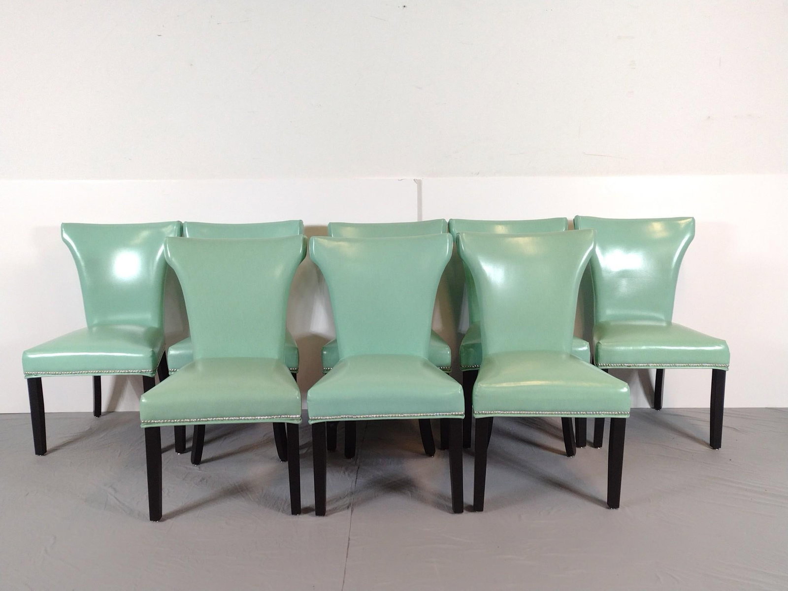 Set Of 8 Teal Vinyl Modern Dining Chairs: NOT ELIGIBLE FOR IN-HOUSE SHIPPING. Each 23" wide X 22" deep X 40-1/2" high. No manufactures name found.