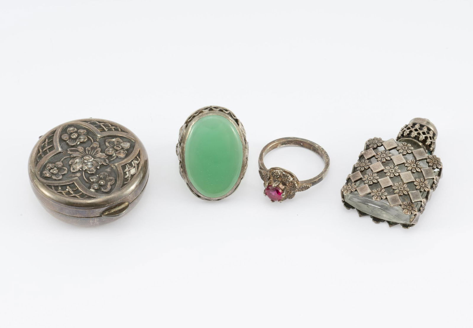 4 Pcs. Sterling Silver incl. Pill Box: Pill box is 1 1/4" diameter. Perfume Bottle is silver lattice on glass bottle 1 3/8" height. Rings size 6 and 7. 32.6 grams including glass and stones.
