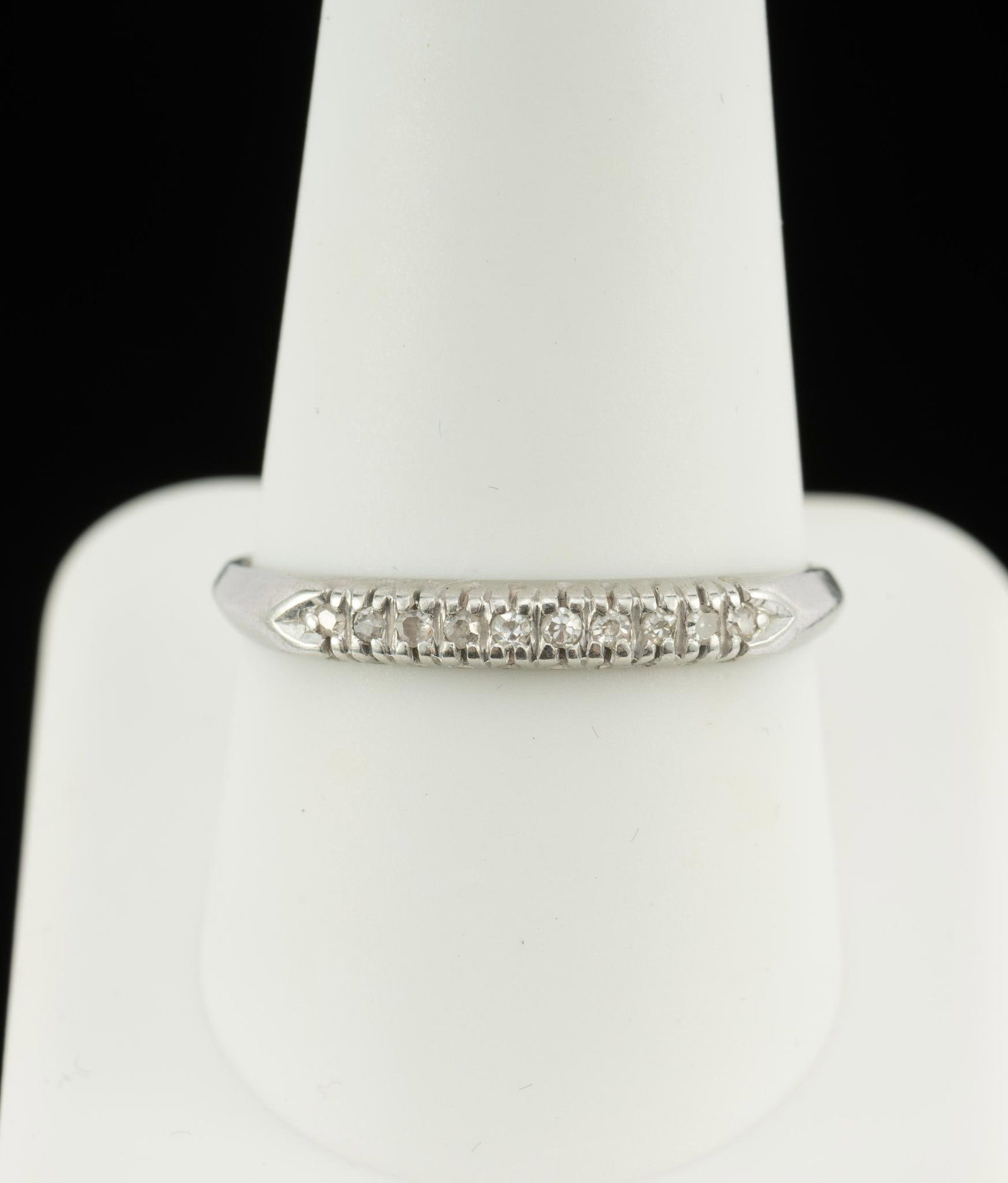Platinum and Diamond Band Ring: A size 10 1/2 ring in platinum with ten small single cut diamonds. 2.7 grams.