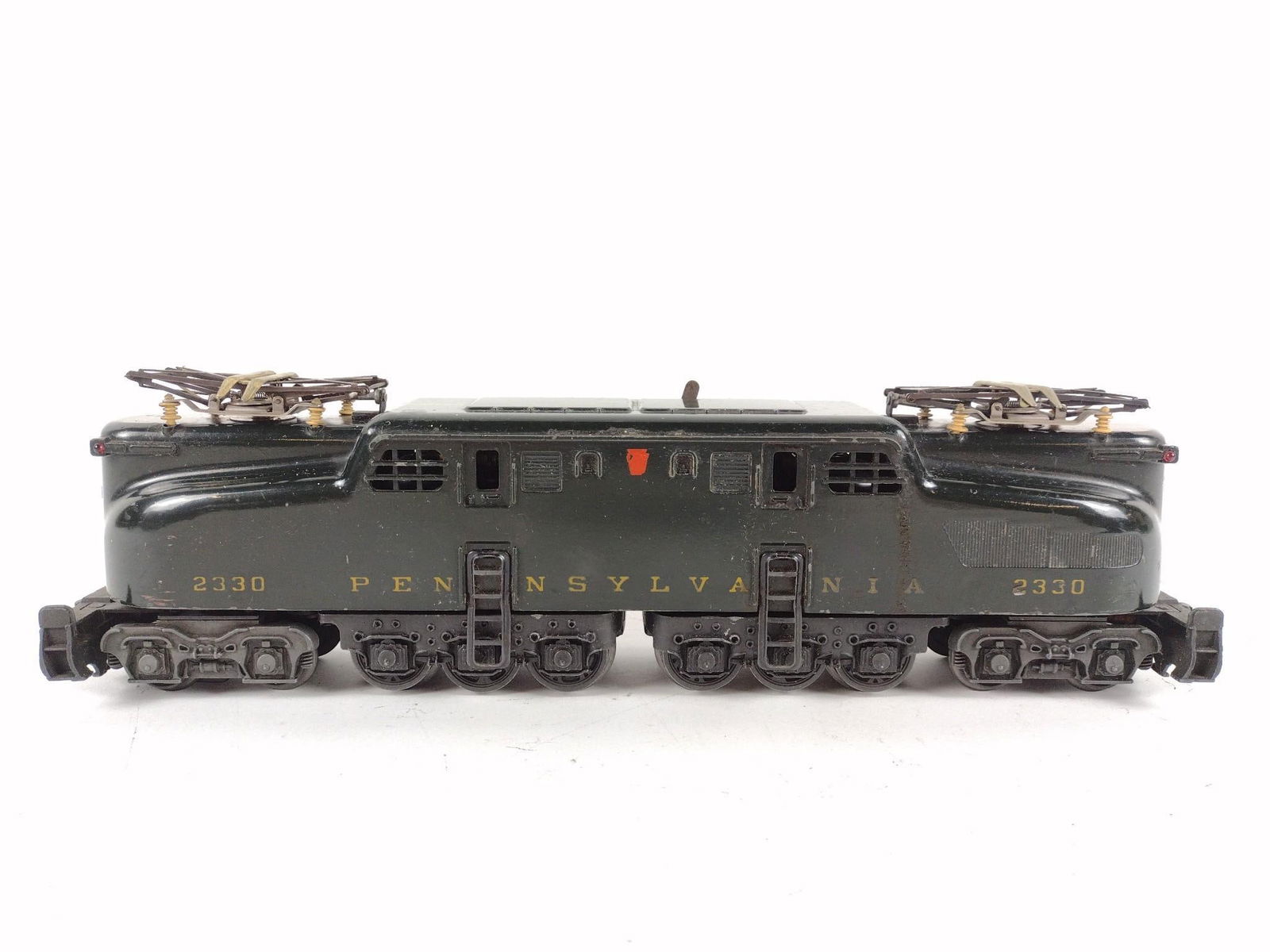 Pennsylvania 2330 Locomotive: O Gauge. 14" long. Train has been run. Some wear consistent with age and use.